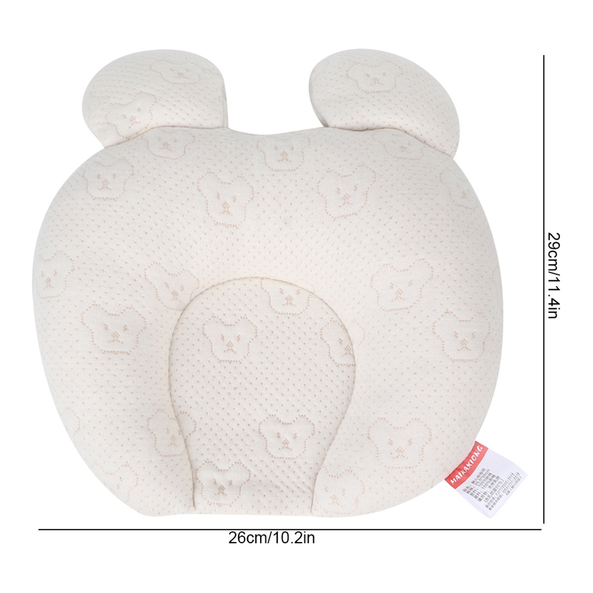 Cremefarbenes Babykissen mit Bärenmuster. Das Kissen ist oval und hat eine Kopfstützenform.