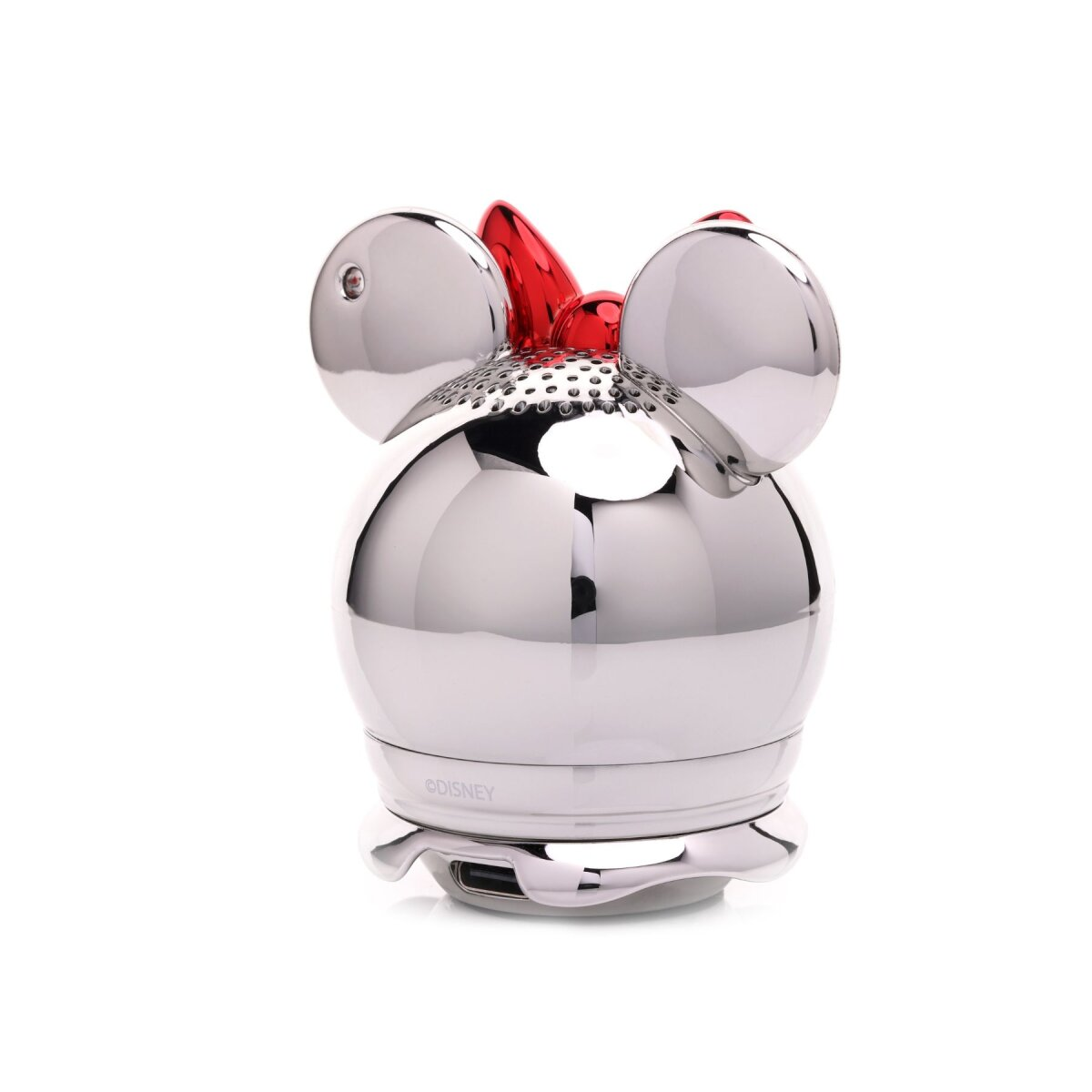 Ein Minnie-Maus-förmiger Lautsprecher. Er hat eine glänzende Silberoberfläche, eine rote Schleife und einen USB-Anschluss. Weißer Hintergrund.