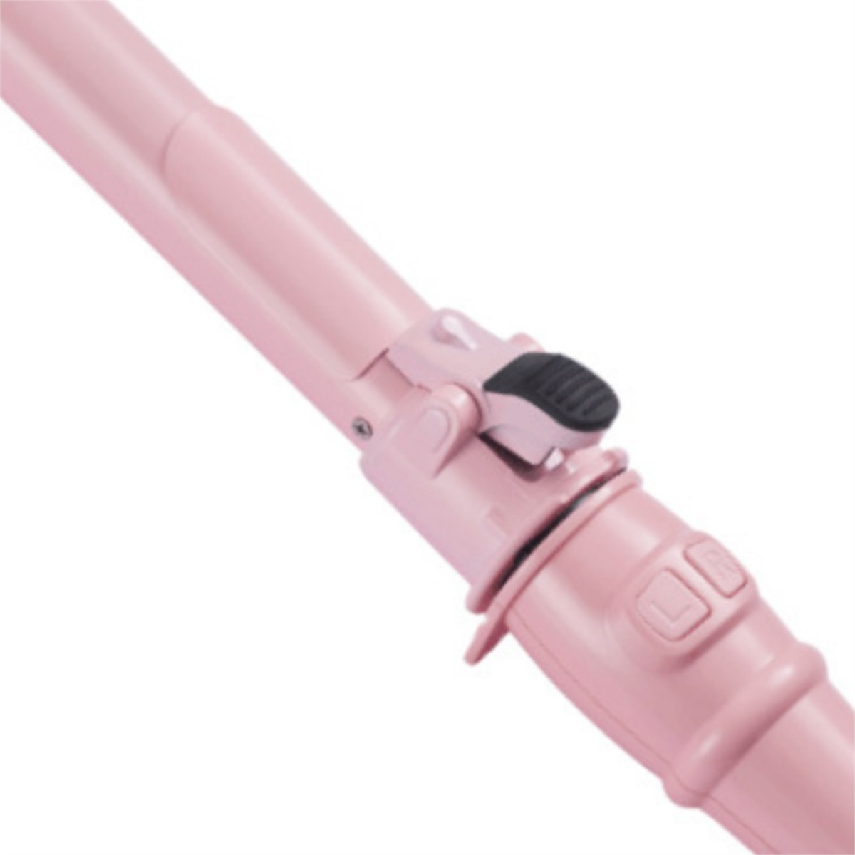 Nahaufnahme eines rosa Staubsaugergriffs, die Bedienelemente zeigend.