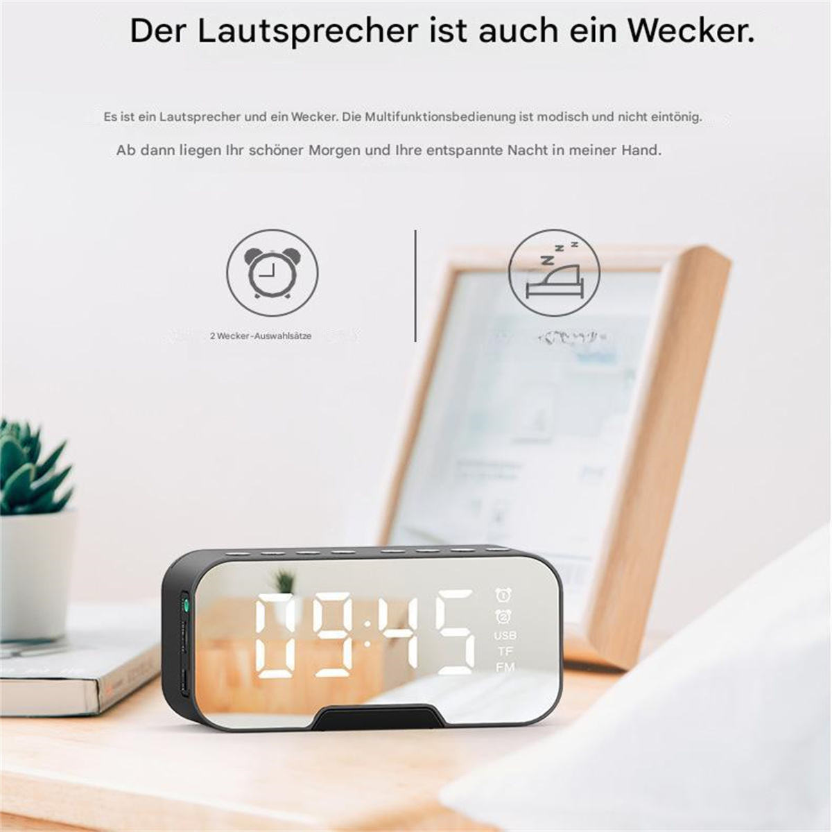 Schwarzer digitaler Wecker mit Spiegelanzeige. Zeigt die Uhrzeit an. Text sagt, es ist ein Lautsprecher und Wecker.