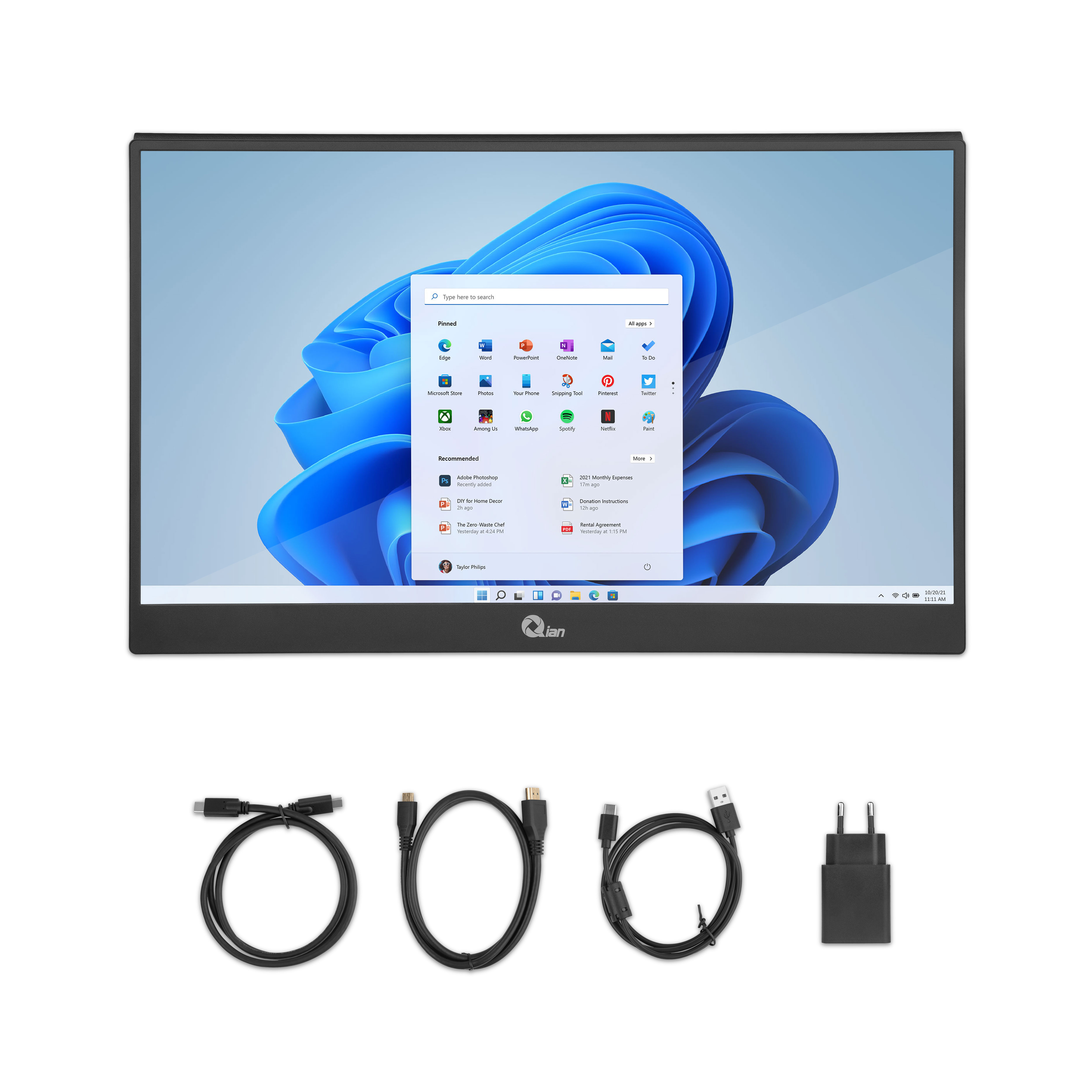 Monitor negro con Windows 11 en pantalla. Accesorios: cables USB-C y adaptador de corriente.