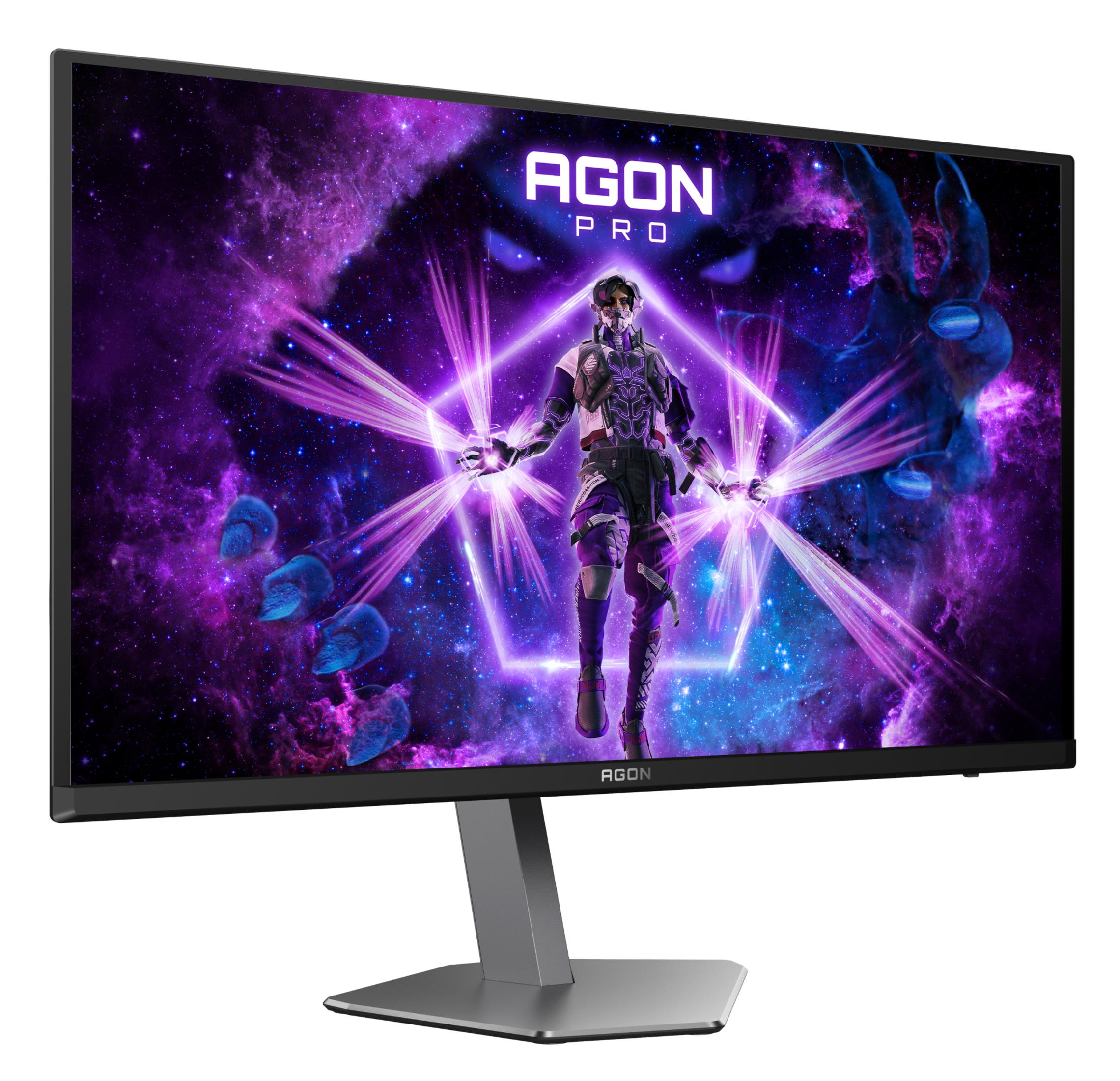 Duży monitor pokazujący futurystyczną scenę z gry z wojownikiem i fioletowymi światłami.