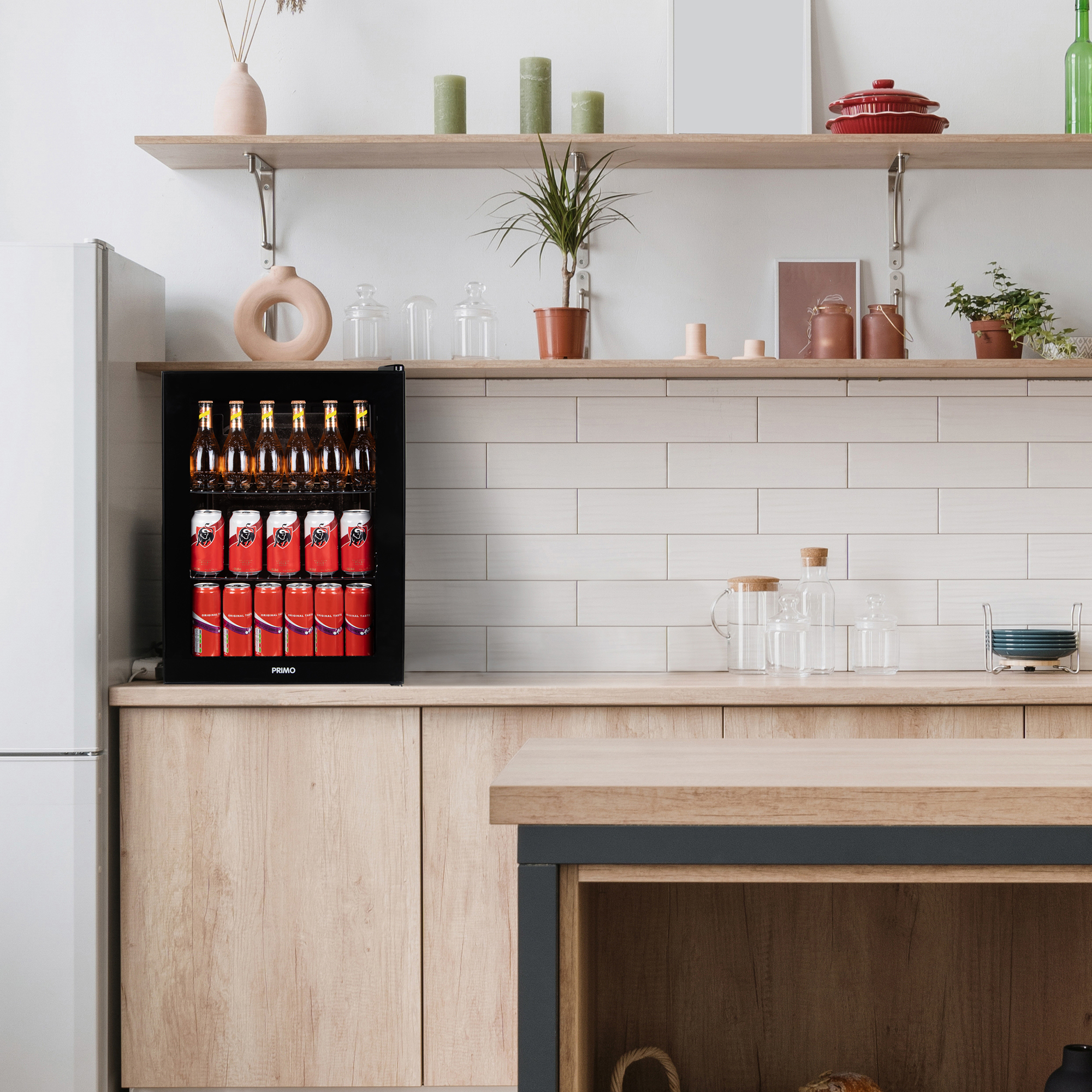 A refrigerator in a kitchen, filled with drinks.