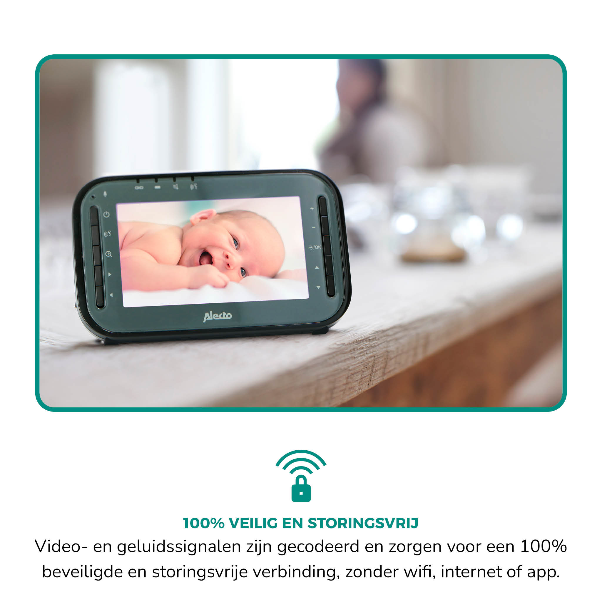 Black baby monitor with a screen showing a baby, on a wooden table.