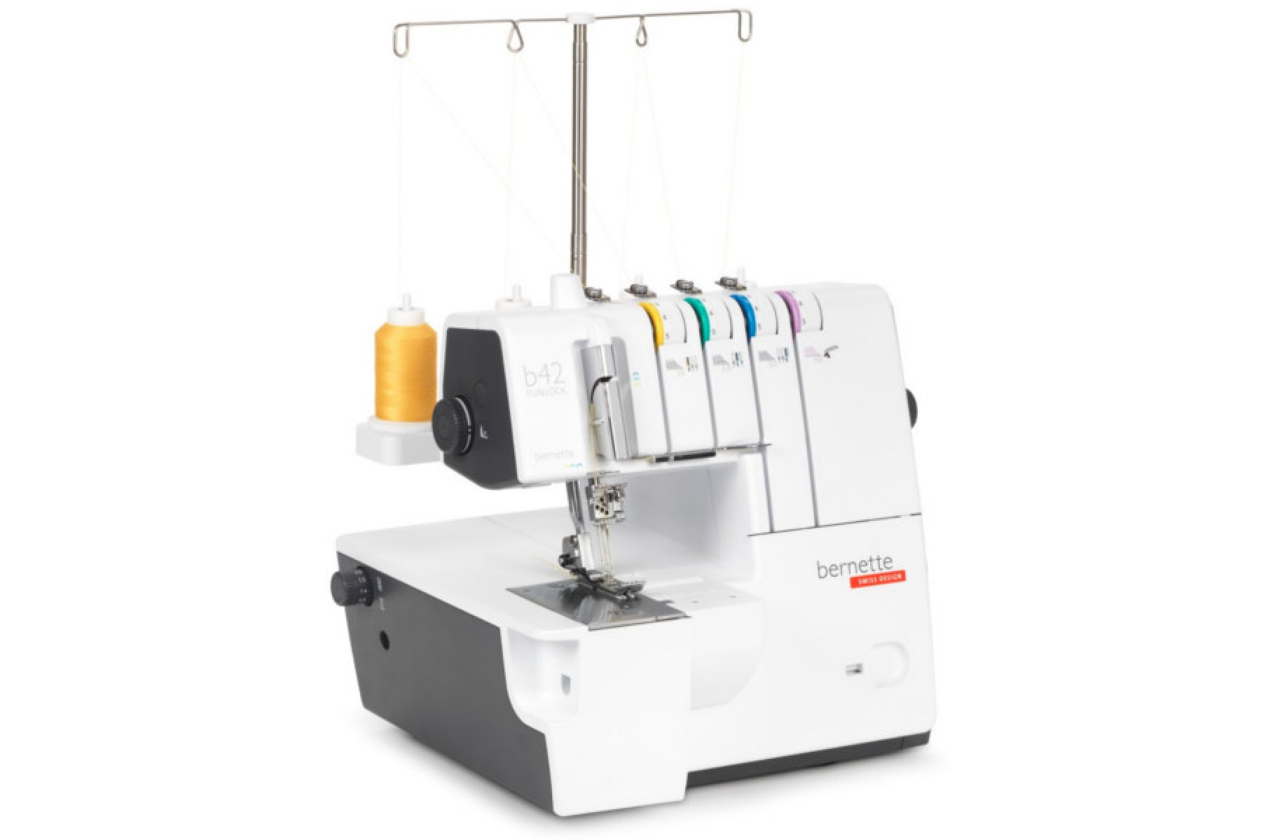Máquina overlock Bernette b42. Cuerpo blanco y negro, con hilos amarillo, verde, azul y morado.