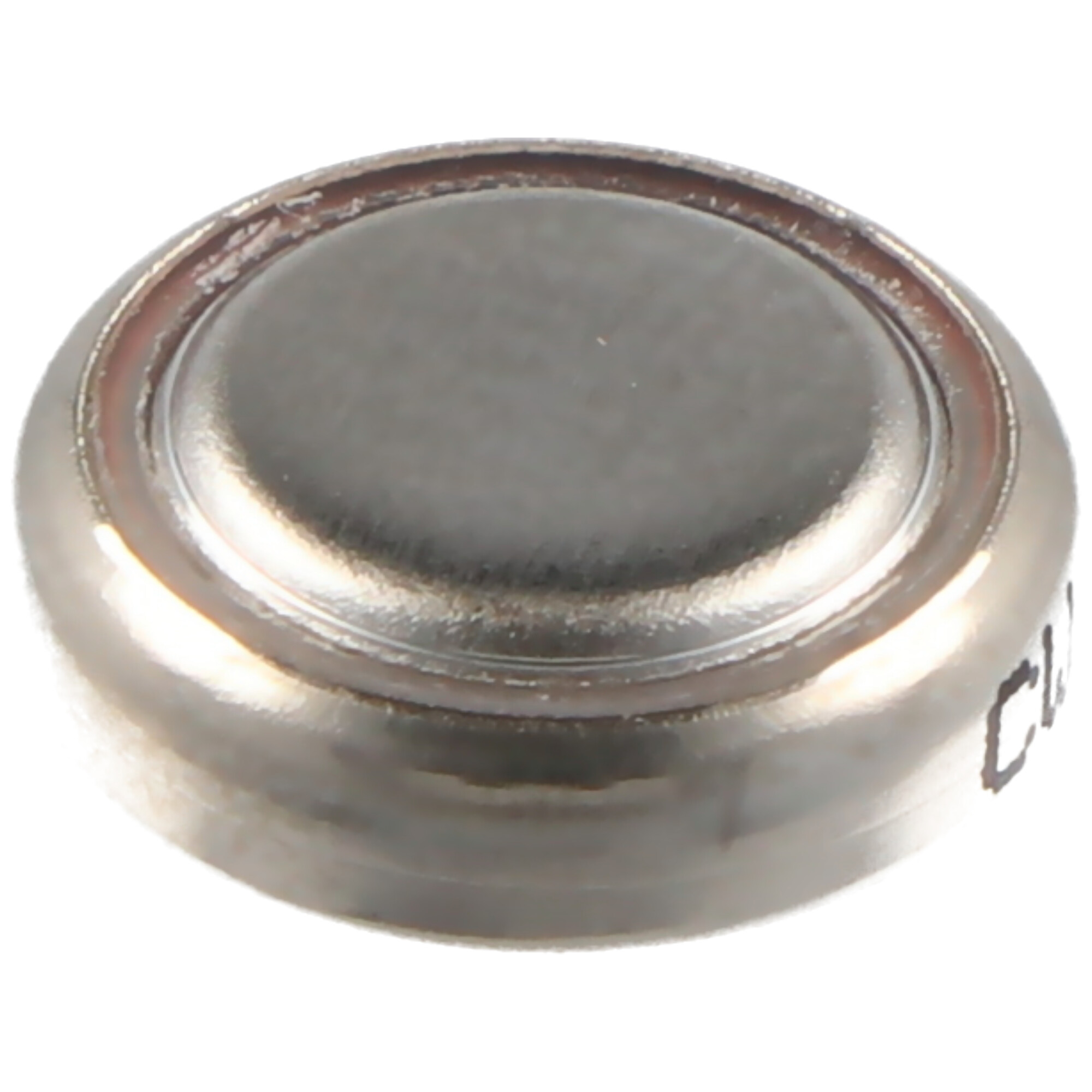 A small, silver, button-shaped battery.
