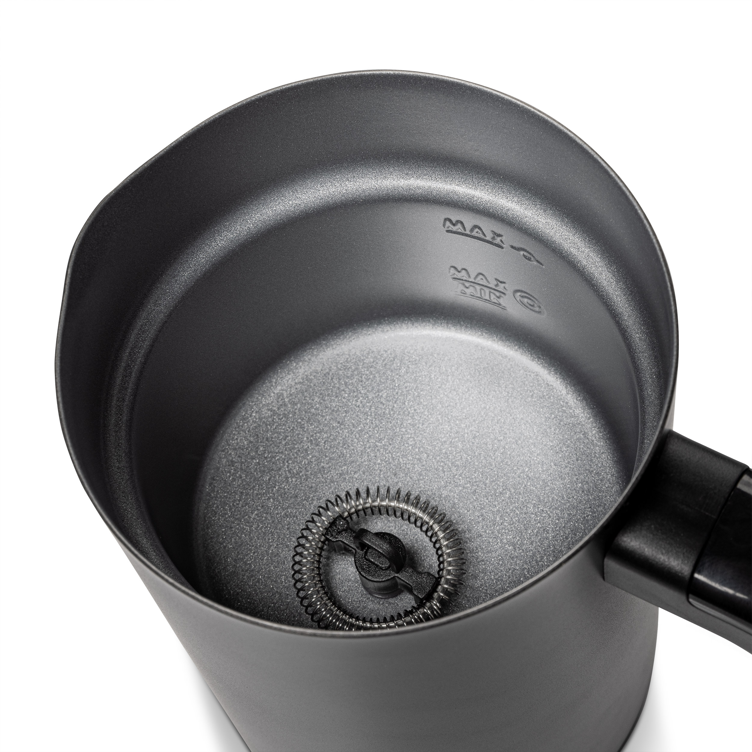 A black milk frother, top view with whisk visible.