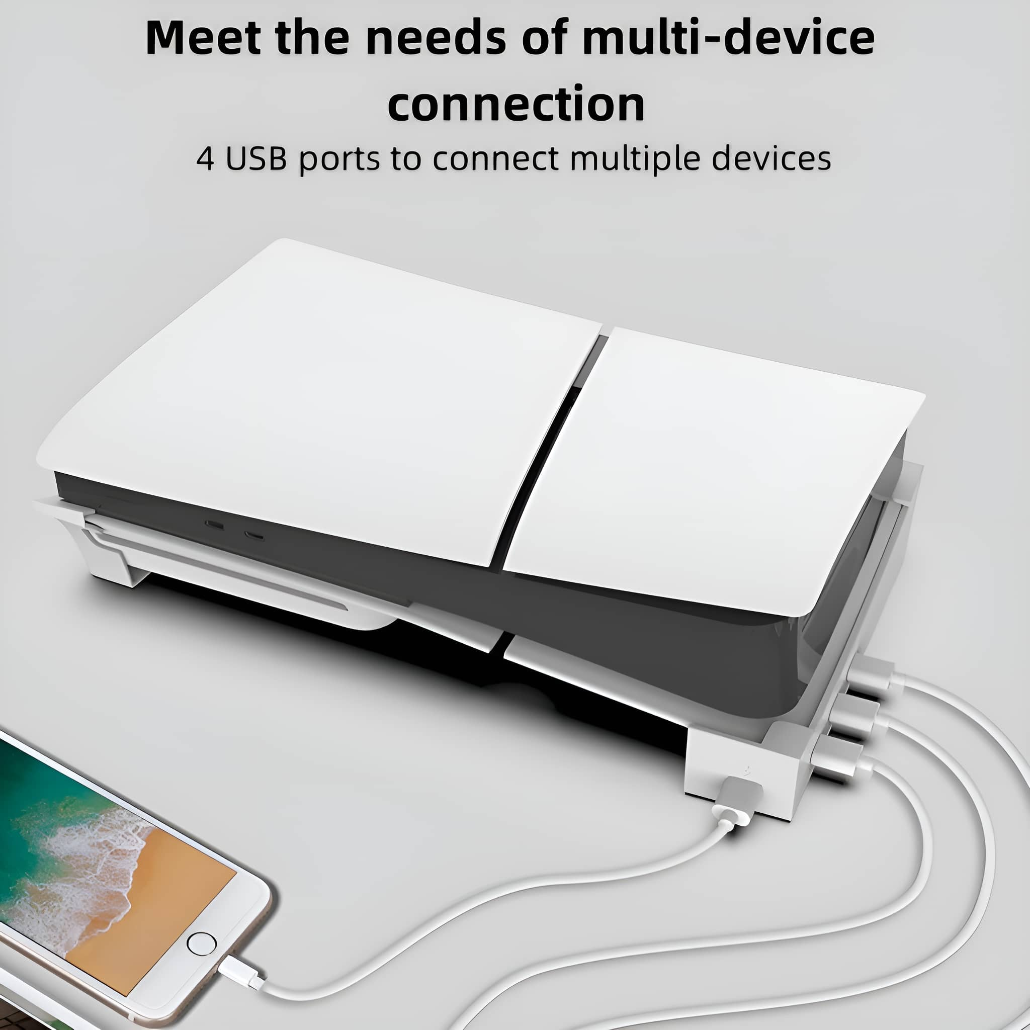 Weiße Konsole mit schwarzer Basis und 4 USB-Anschlüssen, über weiße Kabel mit einem Telefon verbunden.