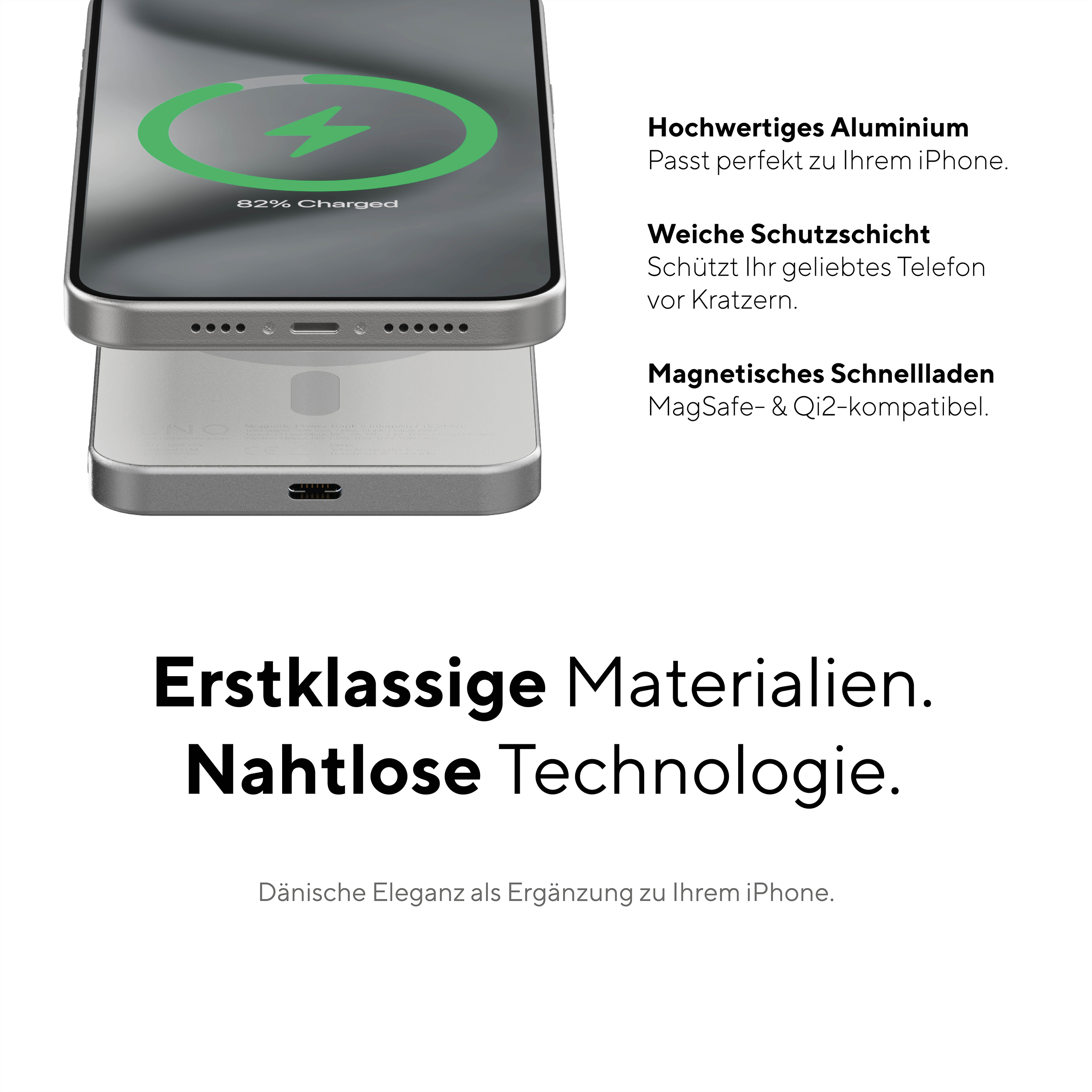 Ein silbernes Telefon auf einem weißen Ladepad mit deutschem Text.