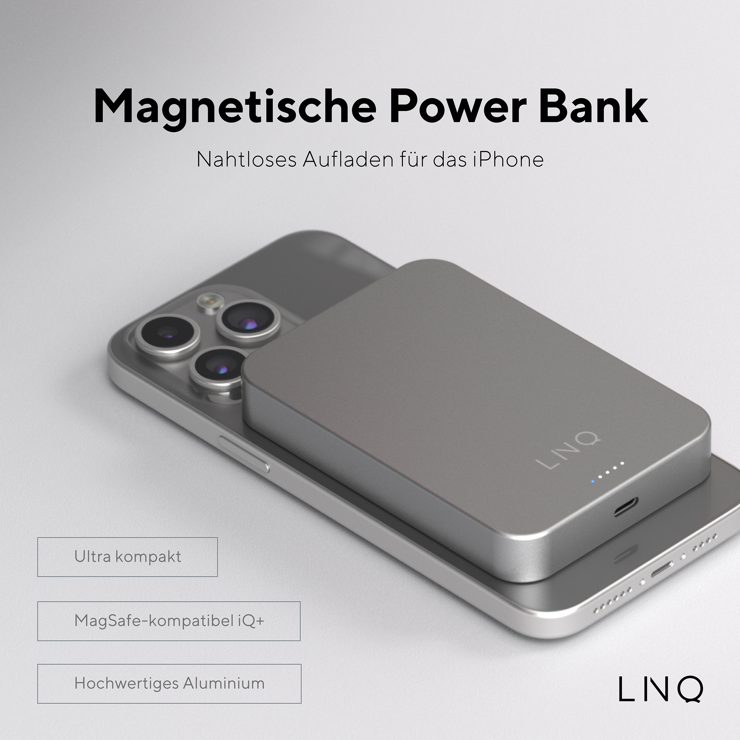 Eine silberne Powerbank auf einem Telefon mit Text über magnetisches Laden und die Marke LNQ.