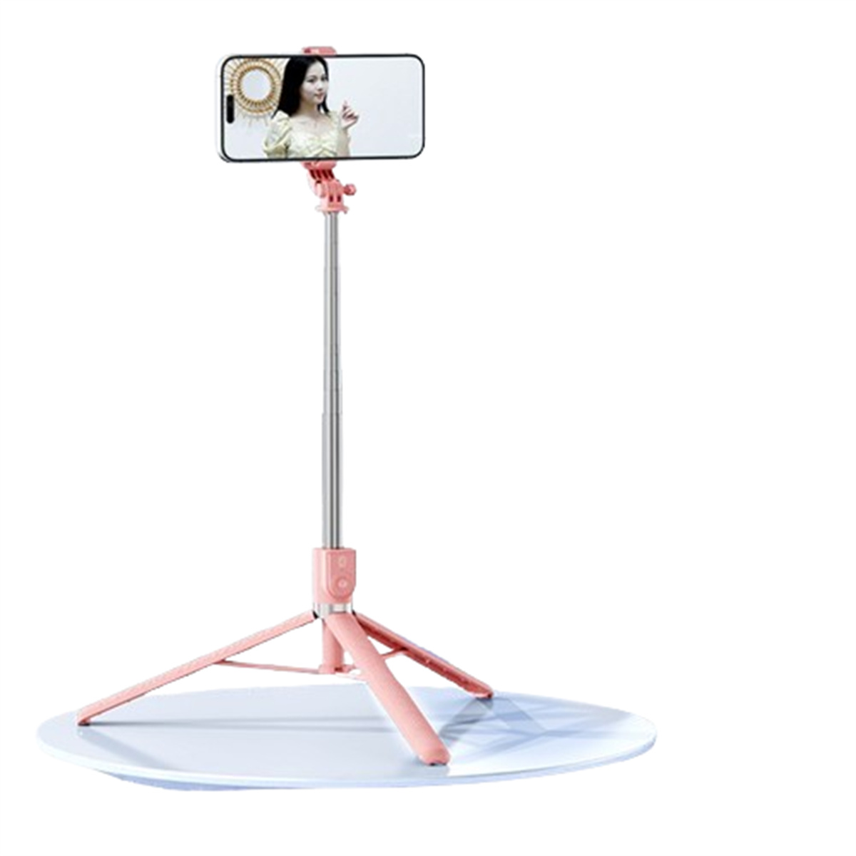 Ein pinkfarbener Selfie-Stick mit einem Telefon, das eine Frau zeigt. Auf weißer Oberfläche, mit kreisförmiger Basis.