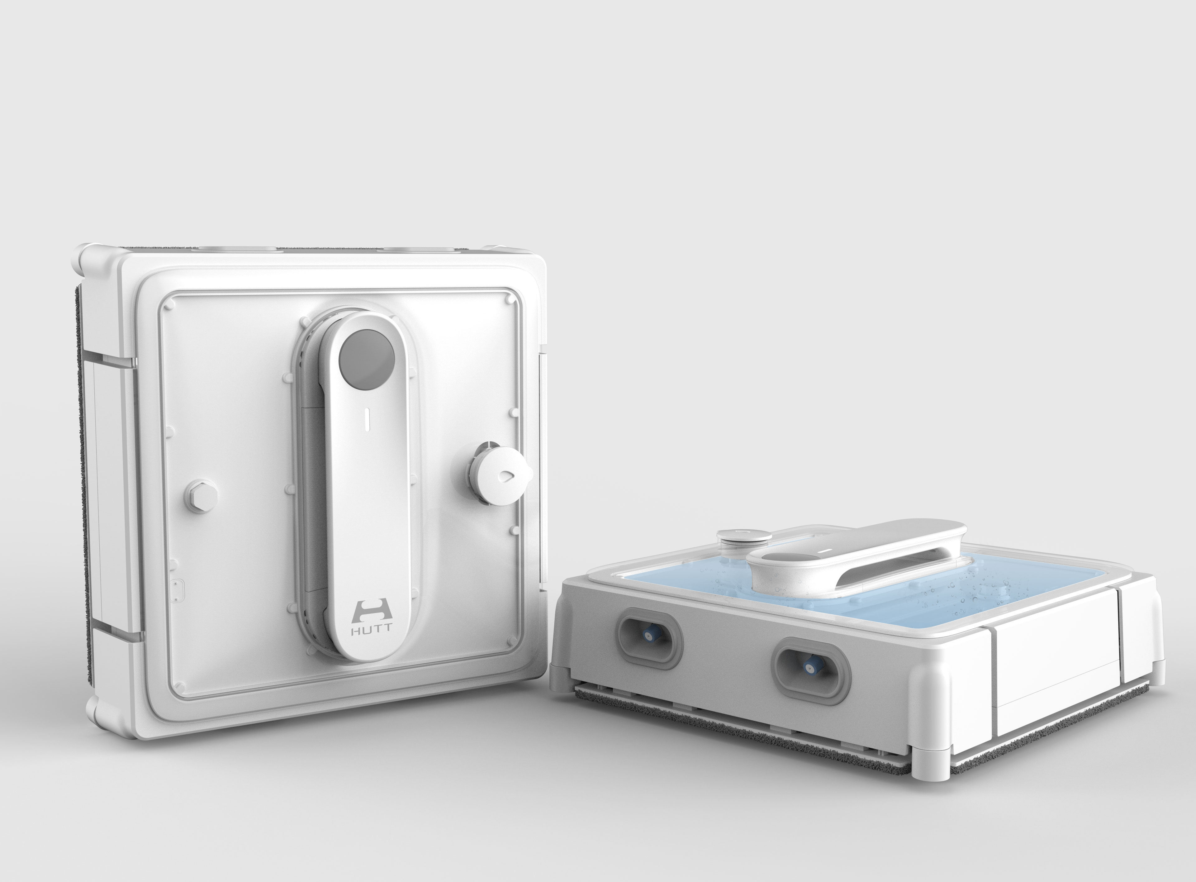 Two white cleaning robots, one upright, the other laying down on the floor.