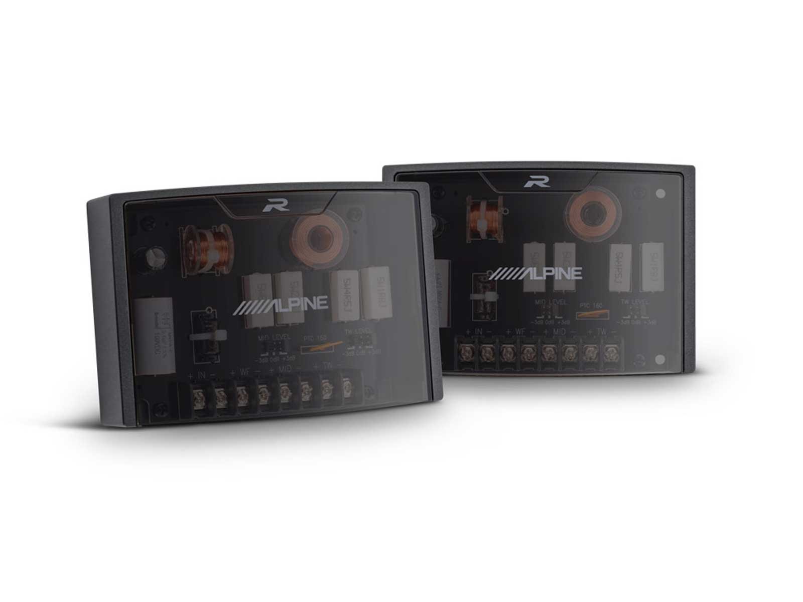 Zwei schwarze Car-Audio-Frequenzweichen auf weißer Oberfläche.