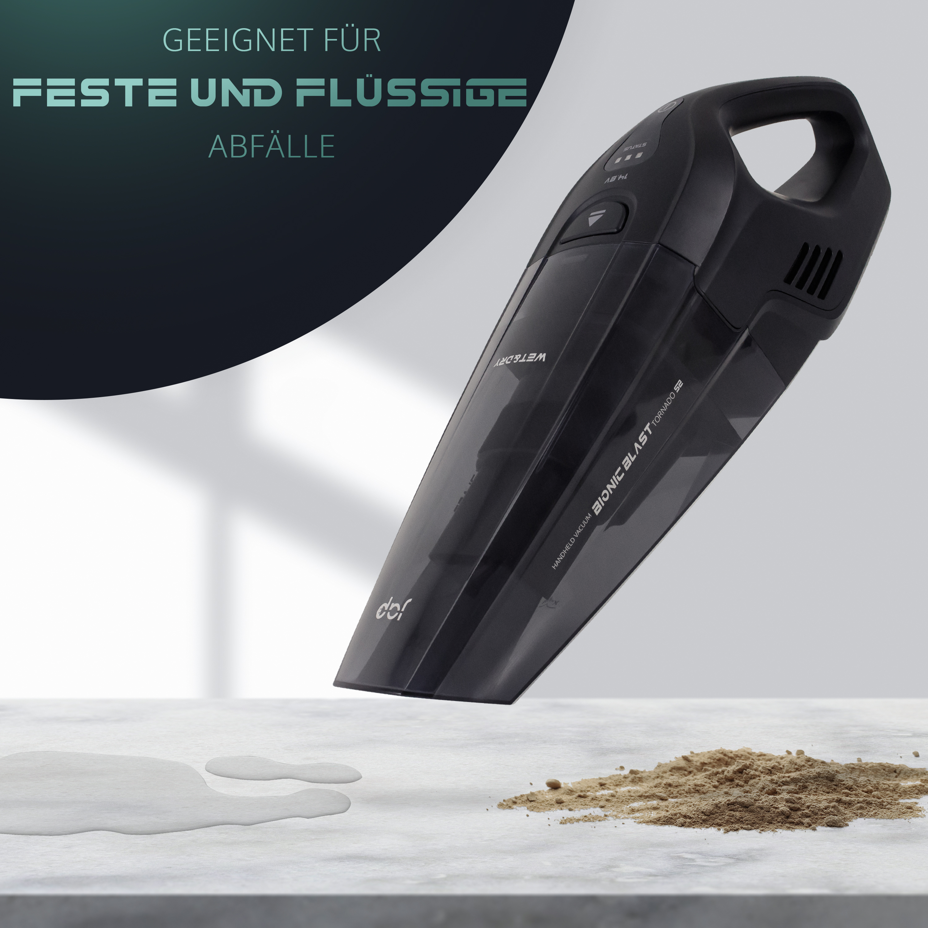 Schwarzer Handstaubsauger auf heller Oberfläche. Text: 'BIONIC BLAST'. Nass-/Trockensauger. Etwas Schmutz auf der Oberfläche.