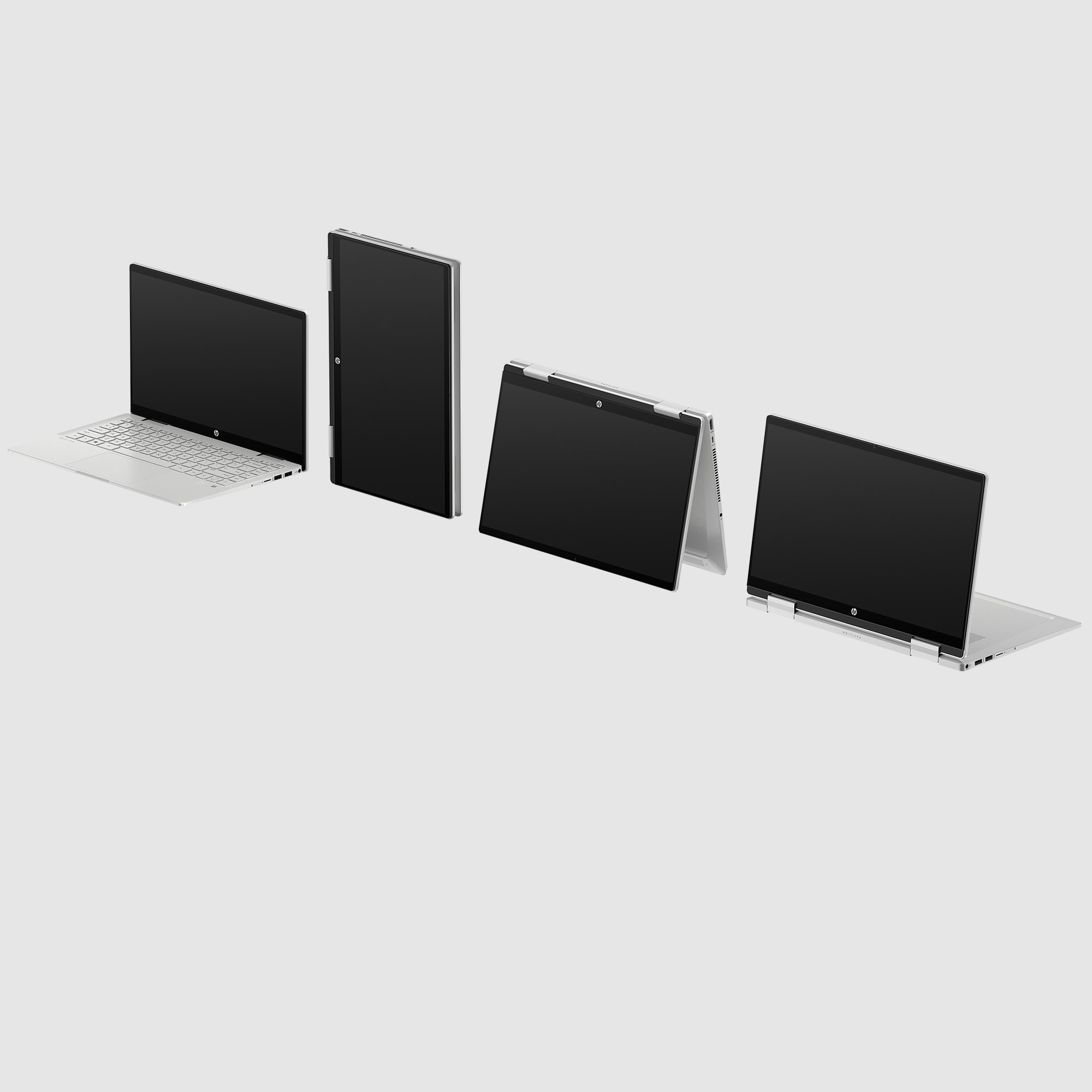 Vier Laptops in verschiedenen Positionen, alle mit schwarzen Bildschirmen, auf weißem Hintergrund.