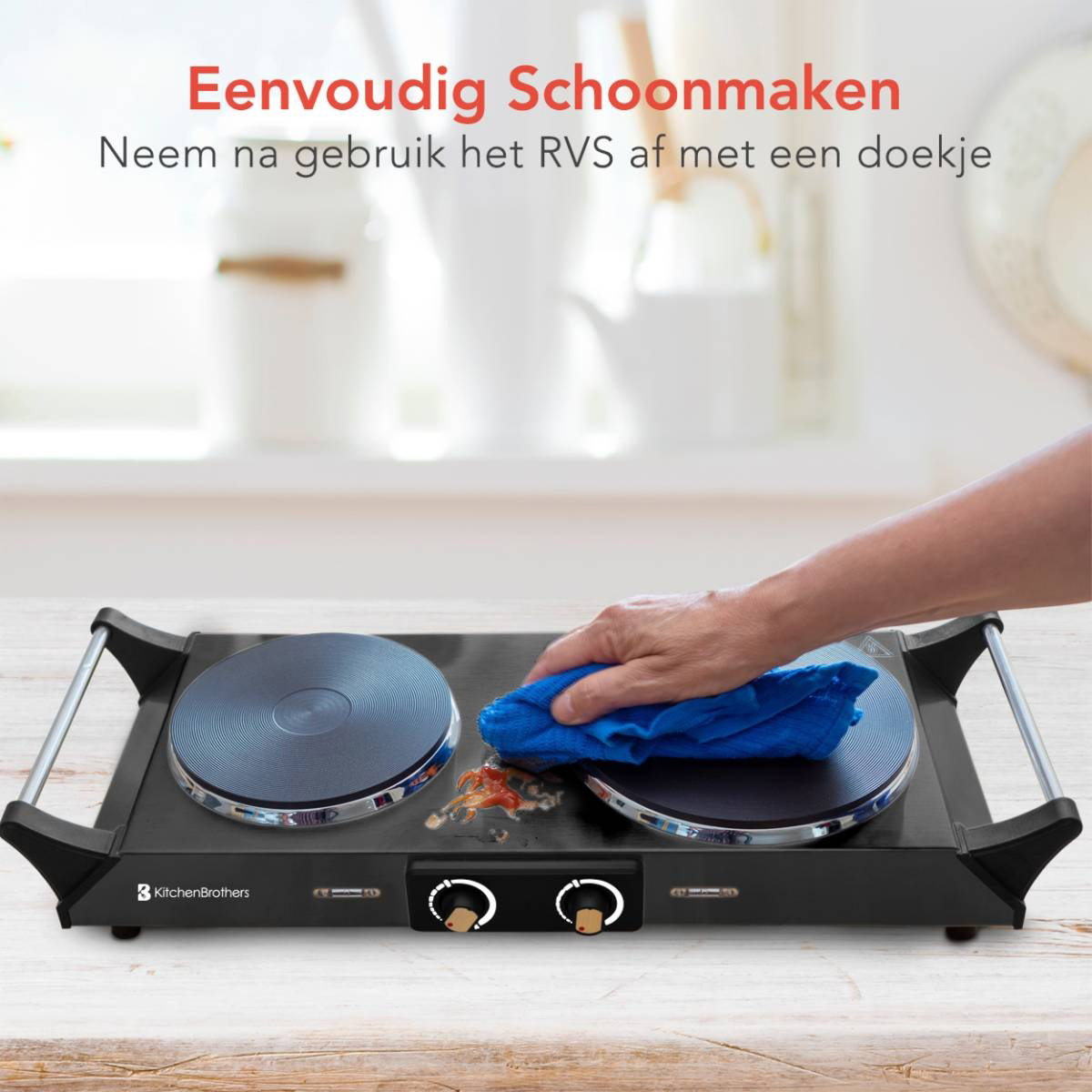 An electric double burner stove with a person cleaning it with a blue cloth.