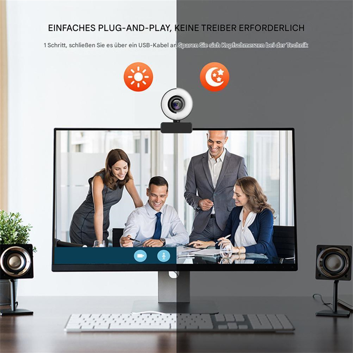 Ein Monitor mit Webcam oben, mit Personen auf dem Bildschirm und Lautsprechern an den Seiten.