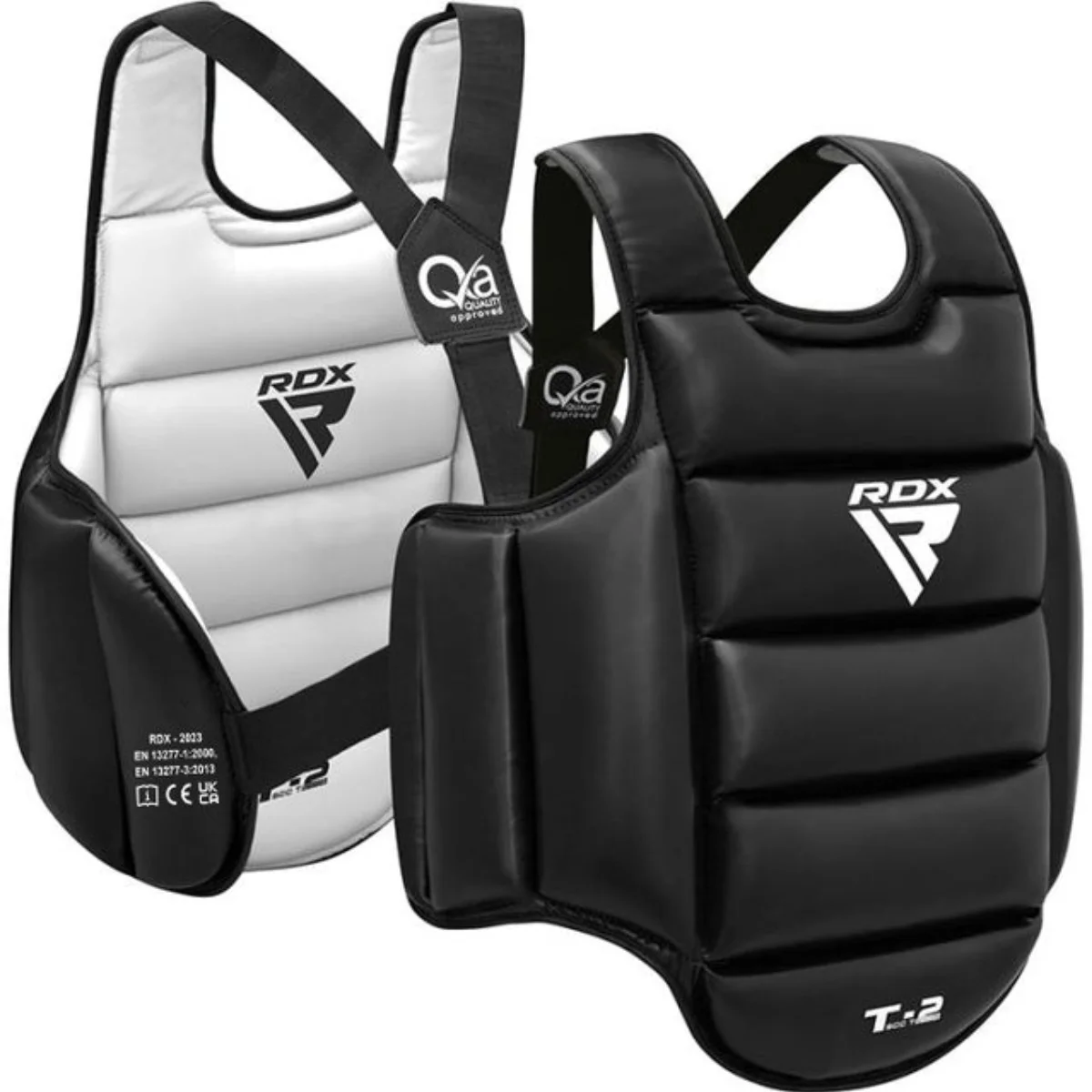 Two boxing chest protectors, one black and one white, with black straps and logos. The protectors are on a white surface.