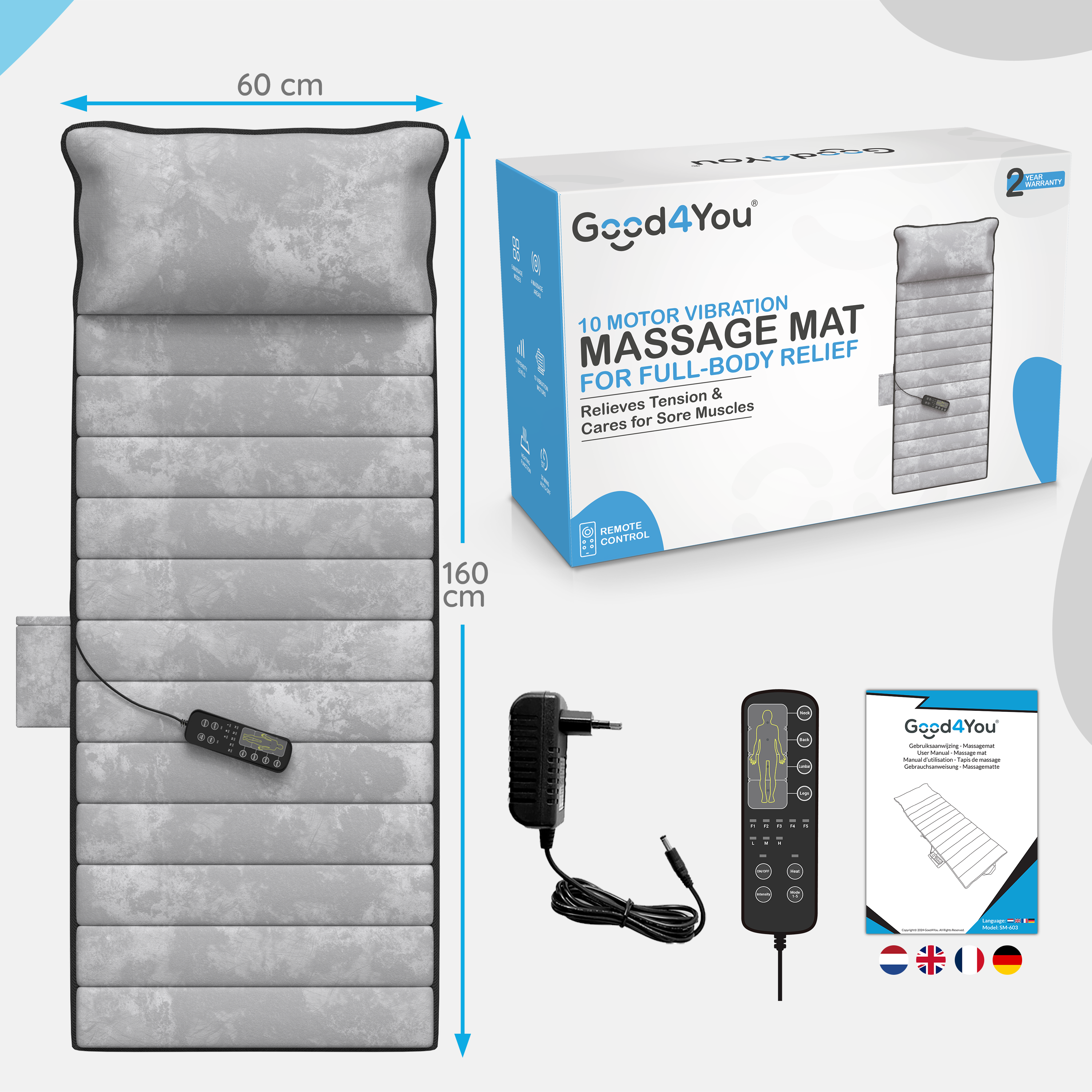 Massagematte, Fernbedienung und Netzteil. Die Matte ist grau, mit einer Box, und die Fernbedienung ist schwarz.