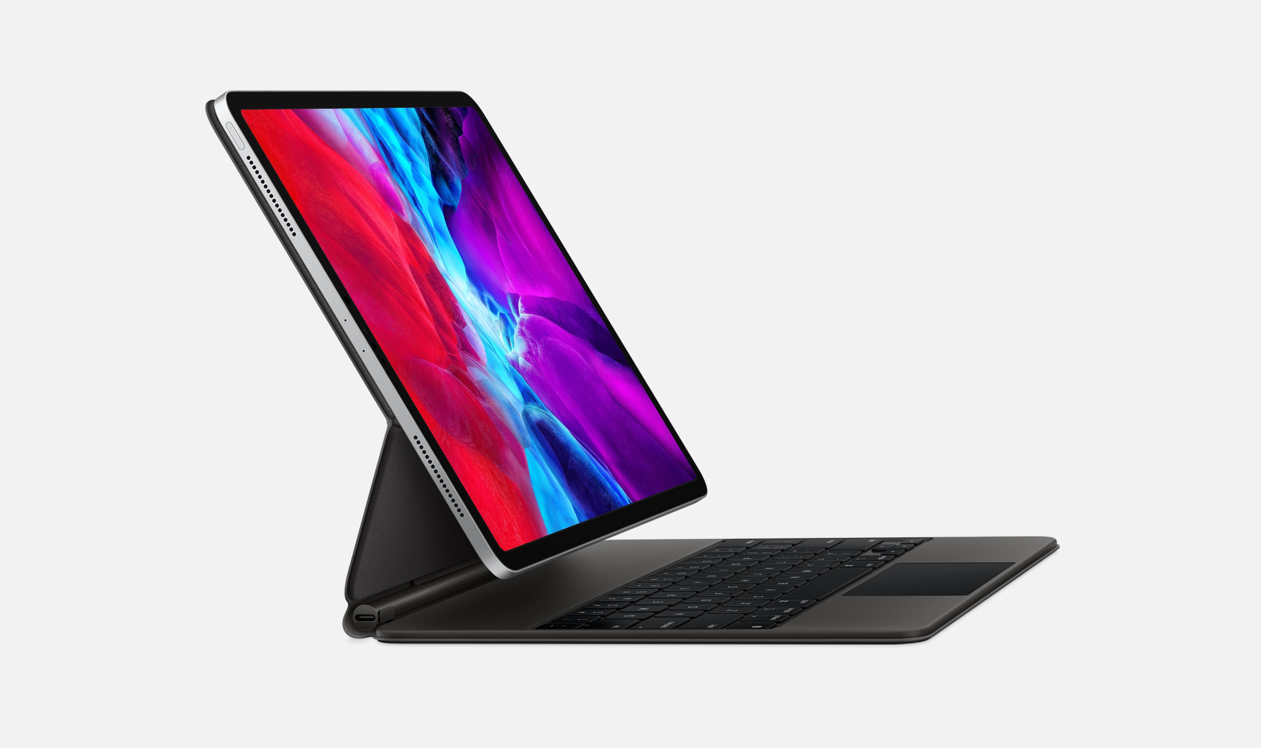 Een iPad Pro met een toetsenbordhoes. Het scherm toont een kleurrijke achtergrond. Het toetsenbord is zwart.