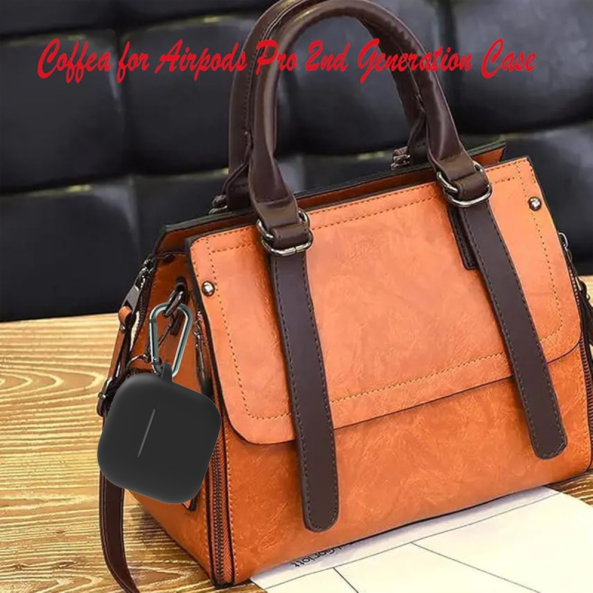 Eine orangefarbene Handtasche mit einer schwarzen Airpods Pro Hülle. Der Text lautet "Coffea for Airpods Pro".
