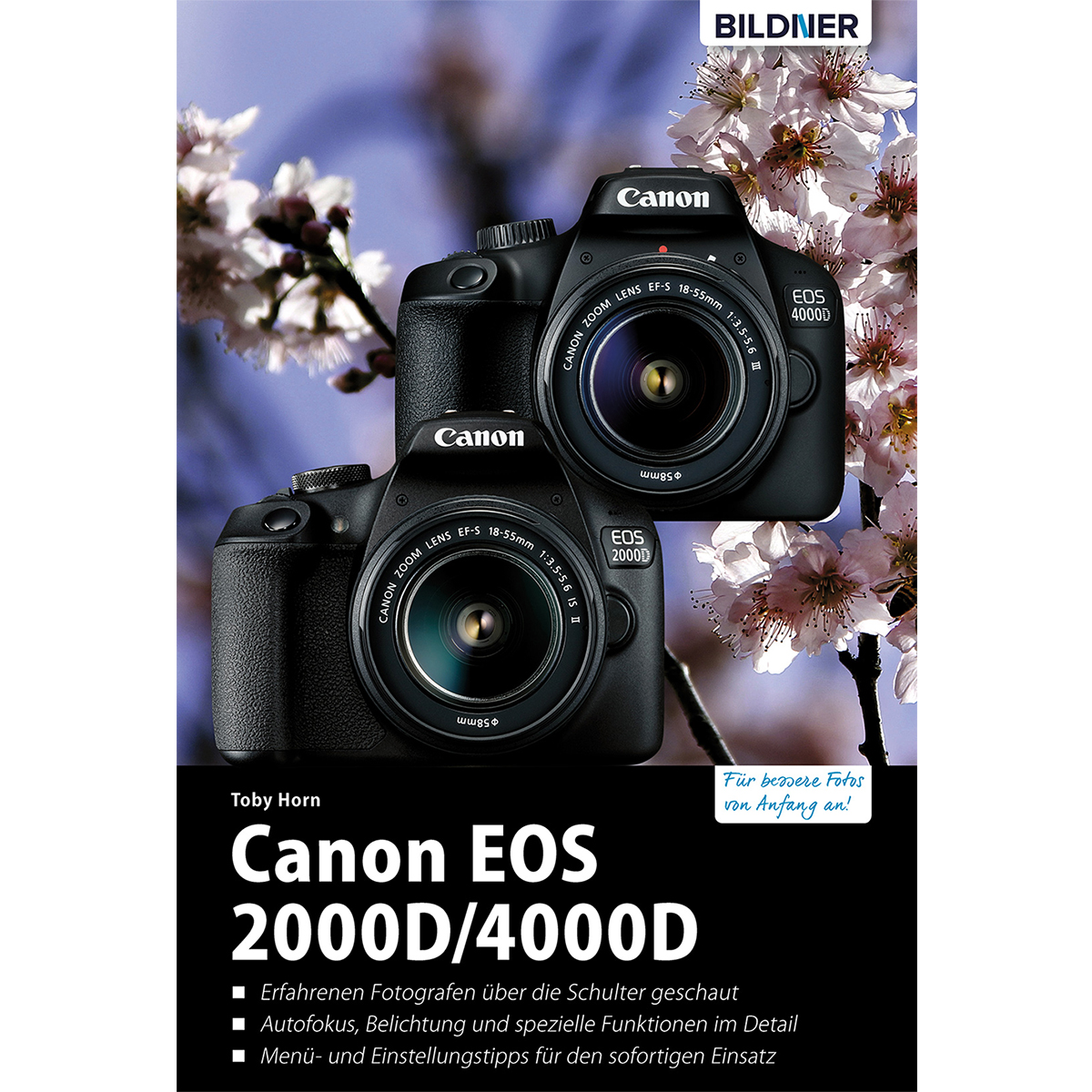 Zwei Canon EOS Kameras auf einem Buch, mit Text und Kirschblüten im Hintergrund.