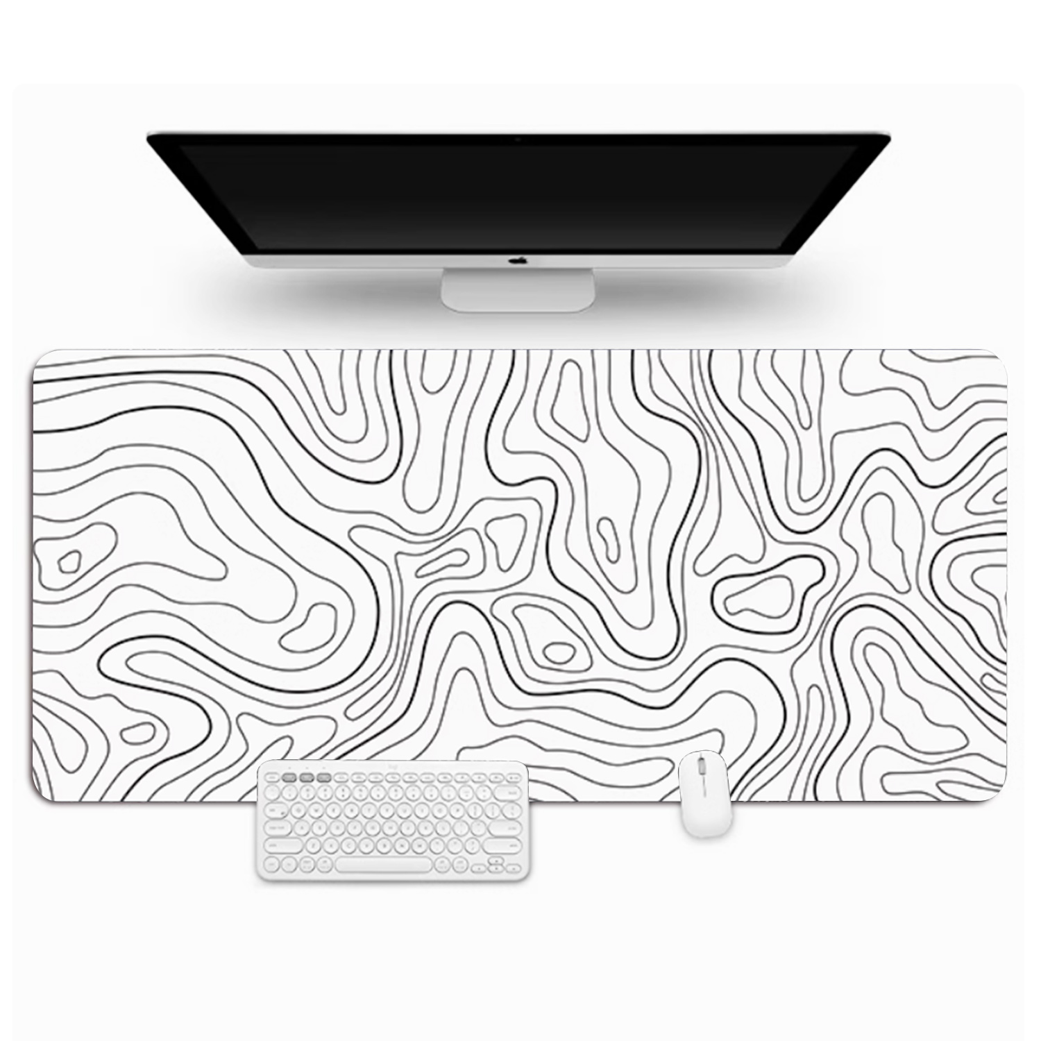 Configuration de bureau blanche avec moniteur, clavier, souris et un grand tapis de bureau avec un design topographique.