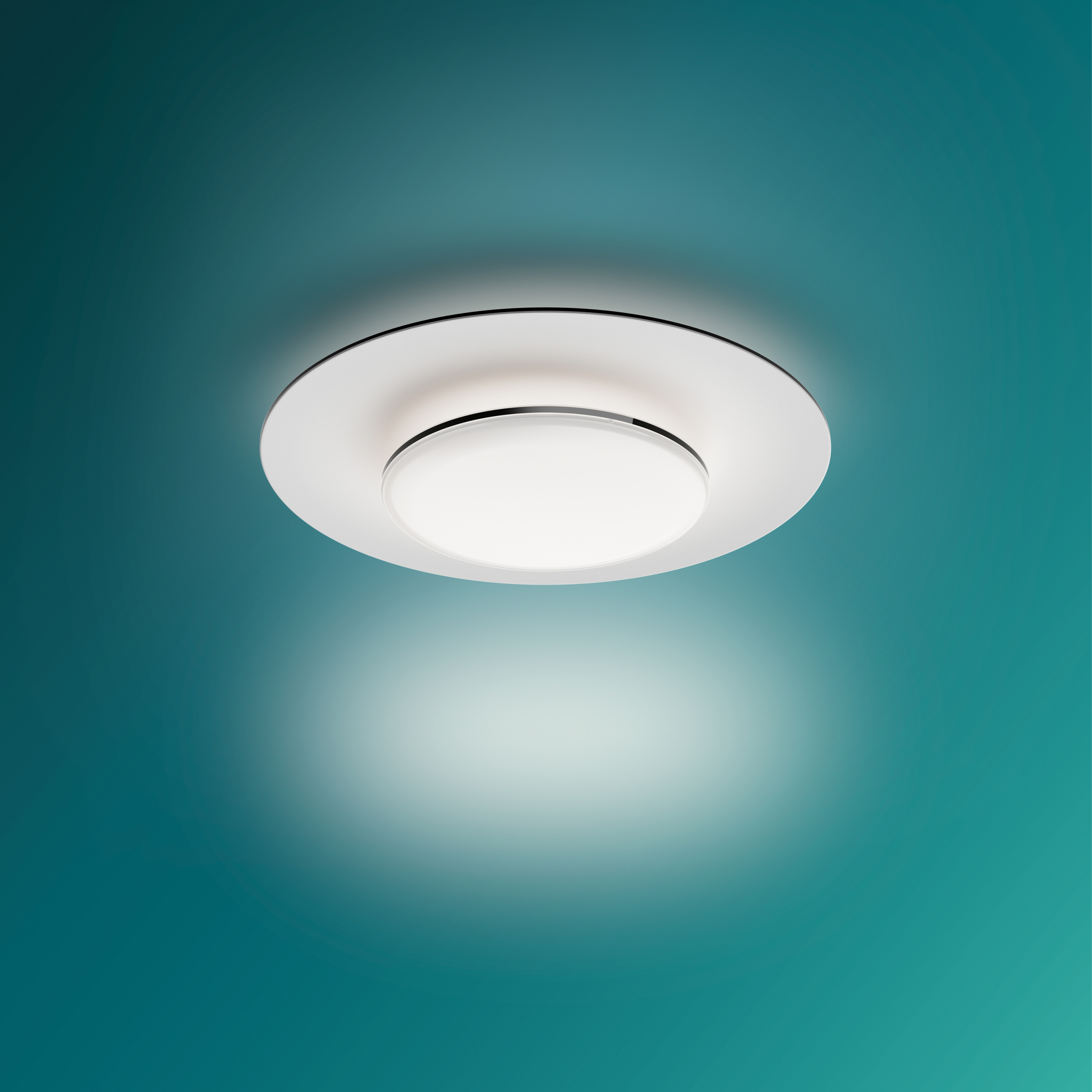 Plafoniera bianca con design circolare e sfondo verde acqua.