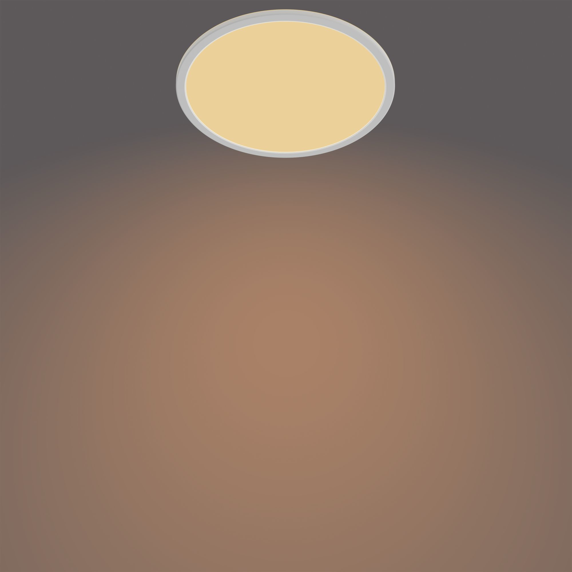 Una luz de techo con centro amarillo. La luz está centrada en un fondo degradado de marrón a gris.