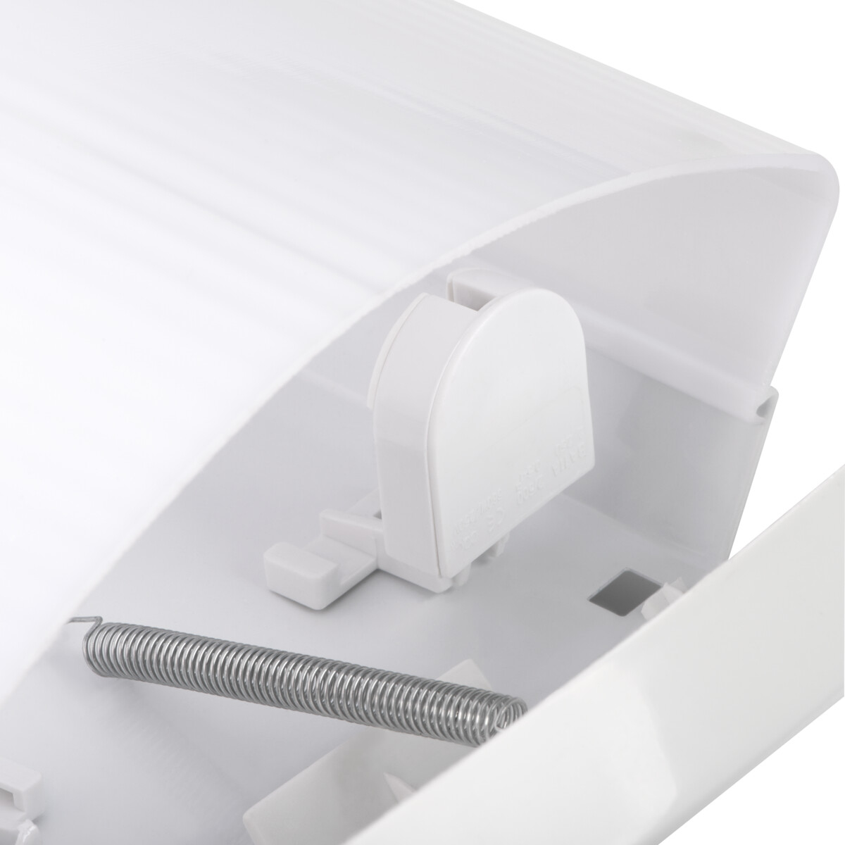 Primo piano di un componente di un apparecchio di illuminazione con una molla e parti in plastica.