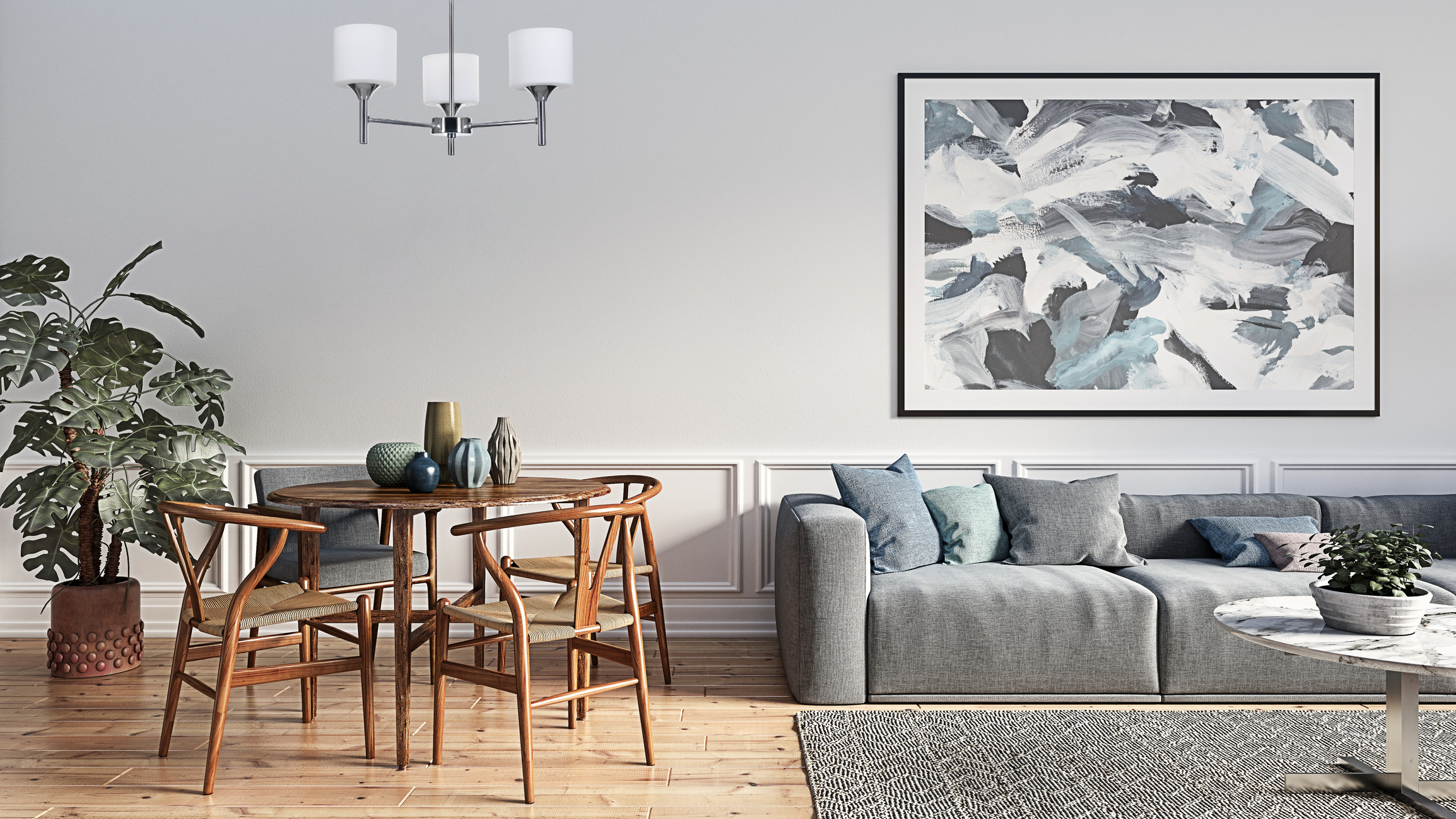 Salon z sofą, stołem, sztuką i krzesłami. Żyrandol wisi nad stołem. Drewniana podłoga.