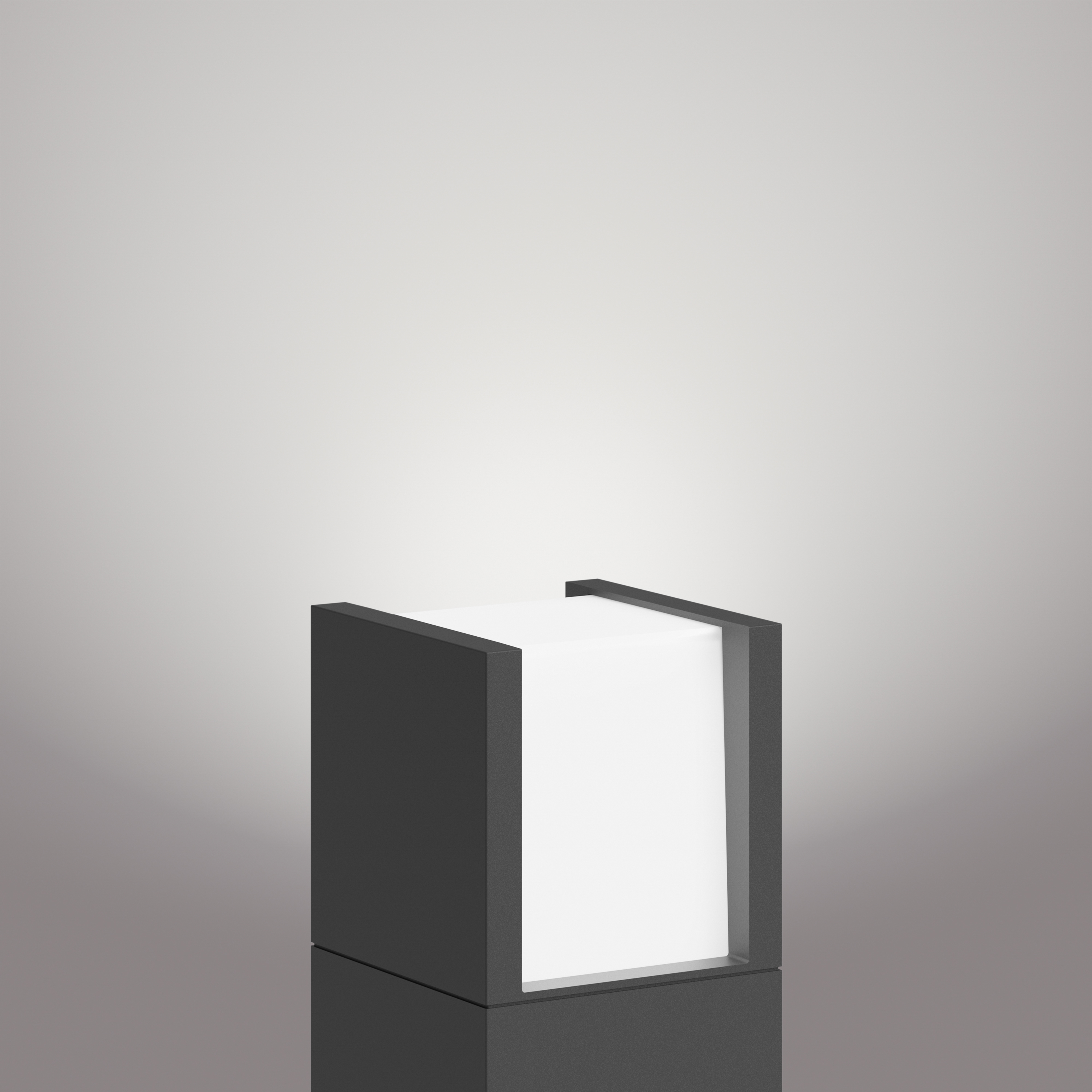 Lampada nera a forma di cubo con un pannello emettitore di luce, su sfondo grigio.