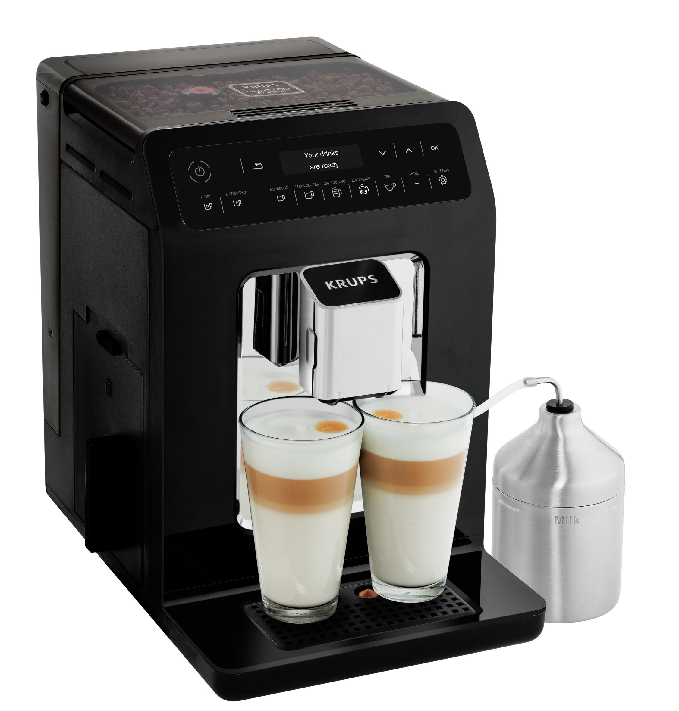 Czarny ekspres do kawy Krups z dwoma latte, pojemnikiem na mleko i tekstem na wyświetlaczu.