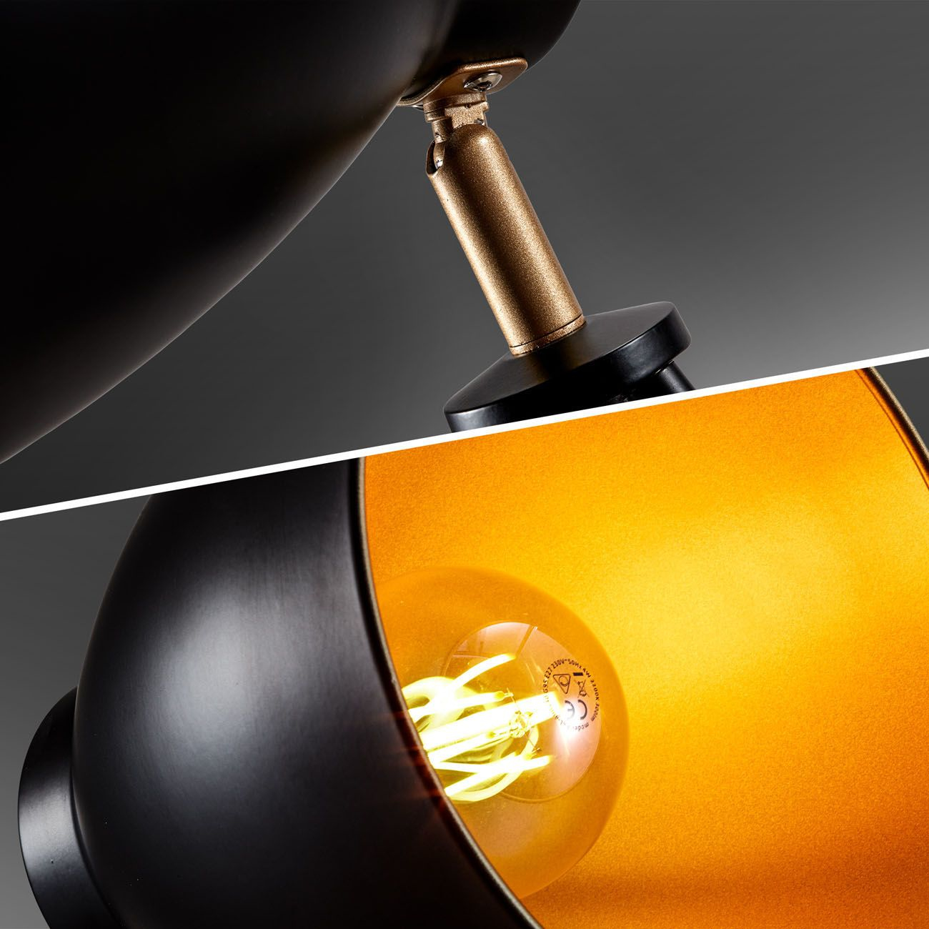Primo piano di una lampada nera con interno dorato e lampadina visibile.