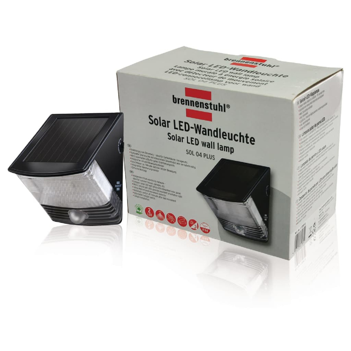 Eine Solar-LED-Wandleuchte in ihrem Karton. Die Lampe ist schwarz mit Solarpanel und Sensor.
