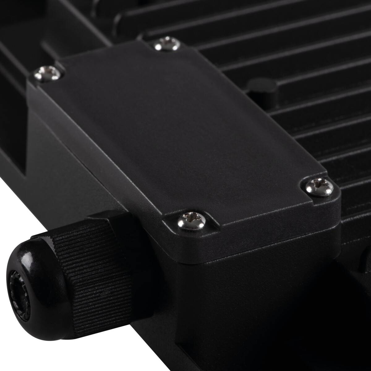 Close-up of a black floodlight showing the connector and a screwed-on cover.