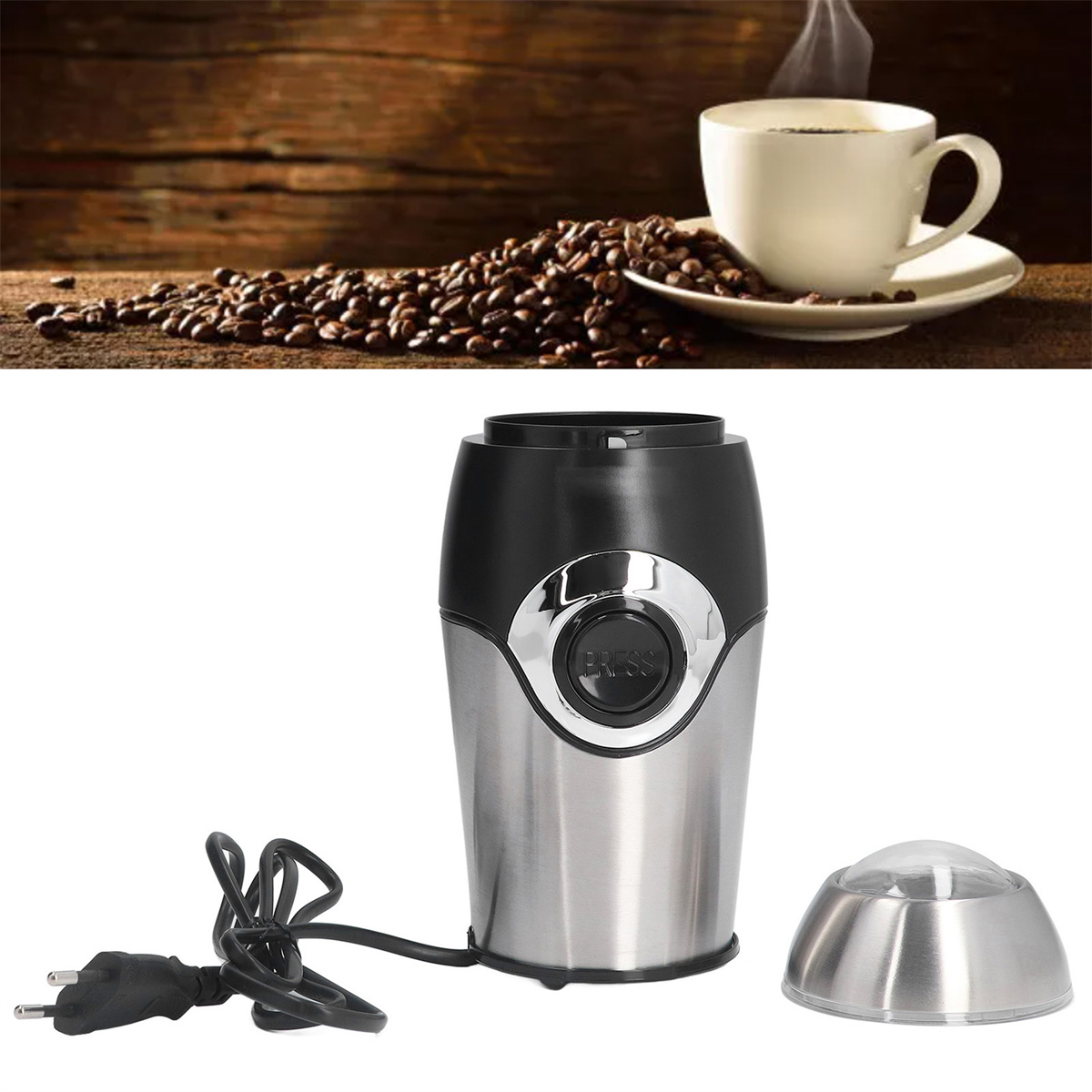 Kaffeemühle neben einer Kaffeetasse und Kaffeebohnen. Die Mühle ist schwarz und silber.