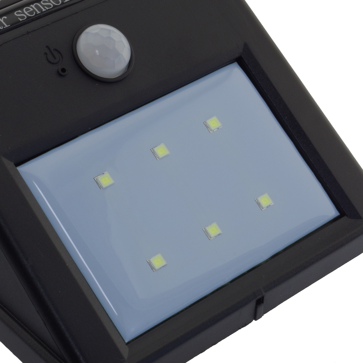 A close-up of a black solar sensor with six small lights on a grey background.
