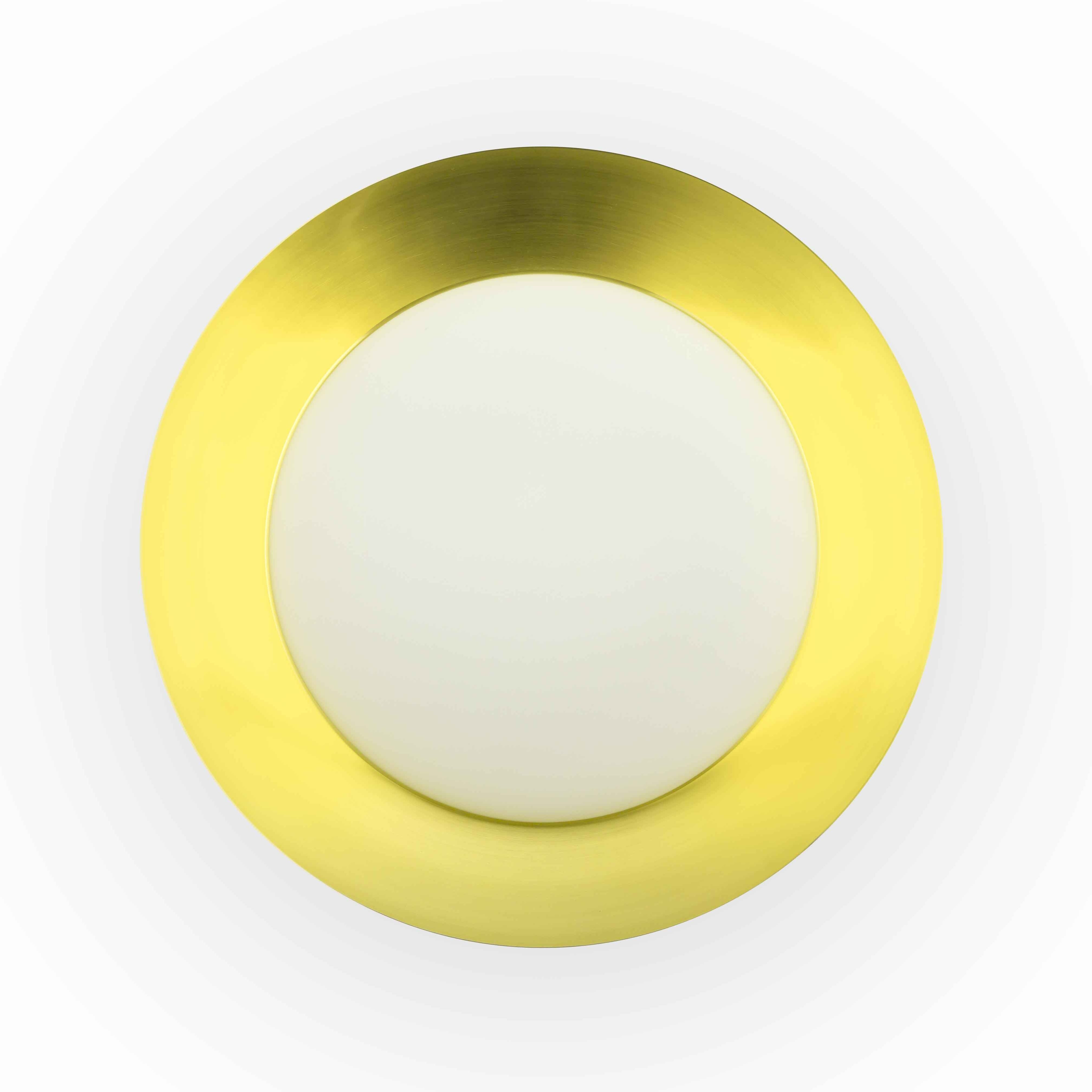 Vista dall'alto di un apparecchio di illuminazione circolare color oro con centro bianco.
