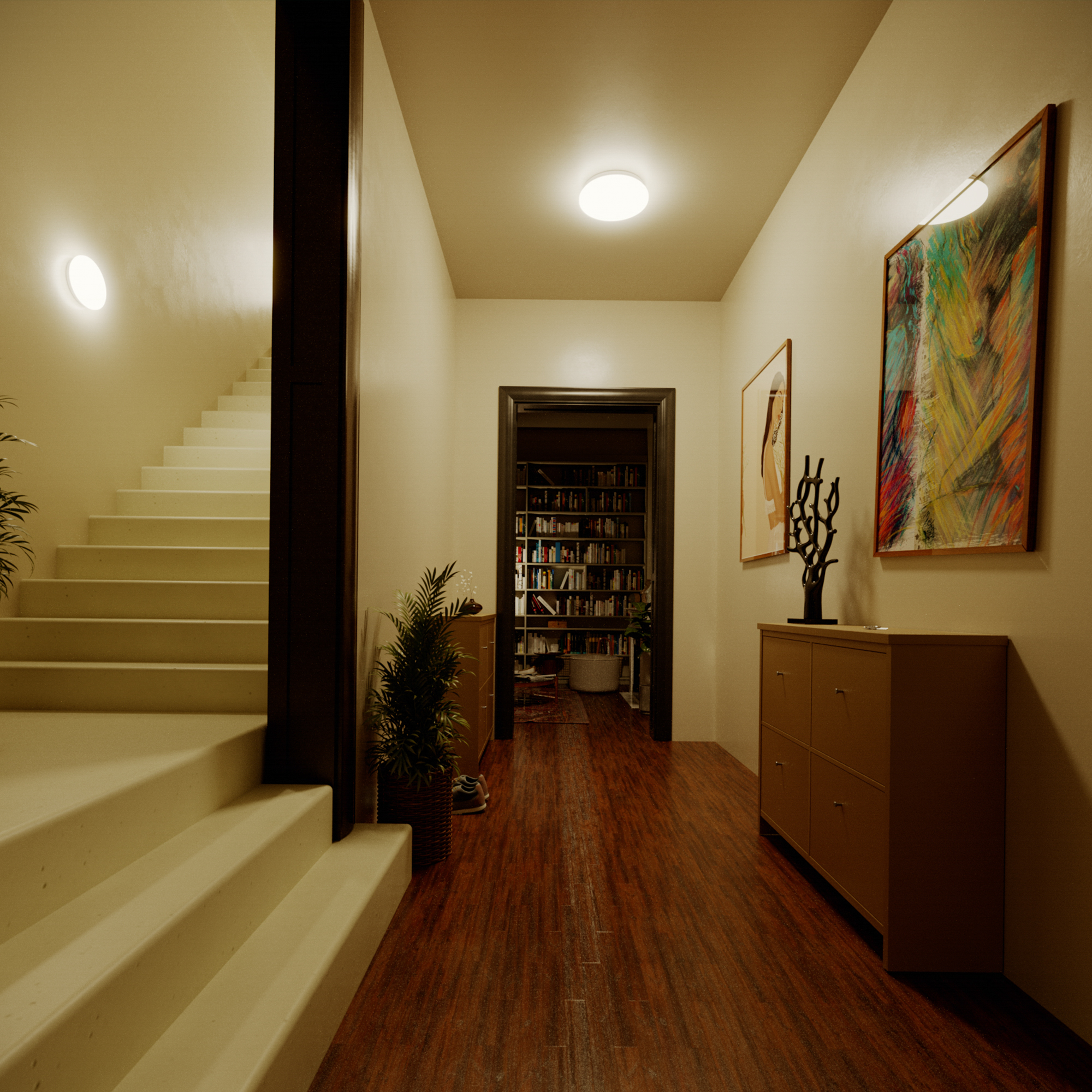 Corridoio con scale, porta verso una stanza con librerie, arte e un'apparecchio di illuminazione.