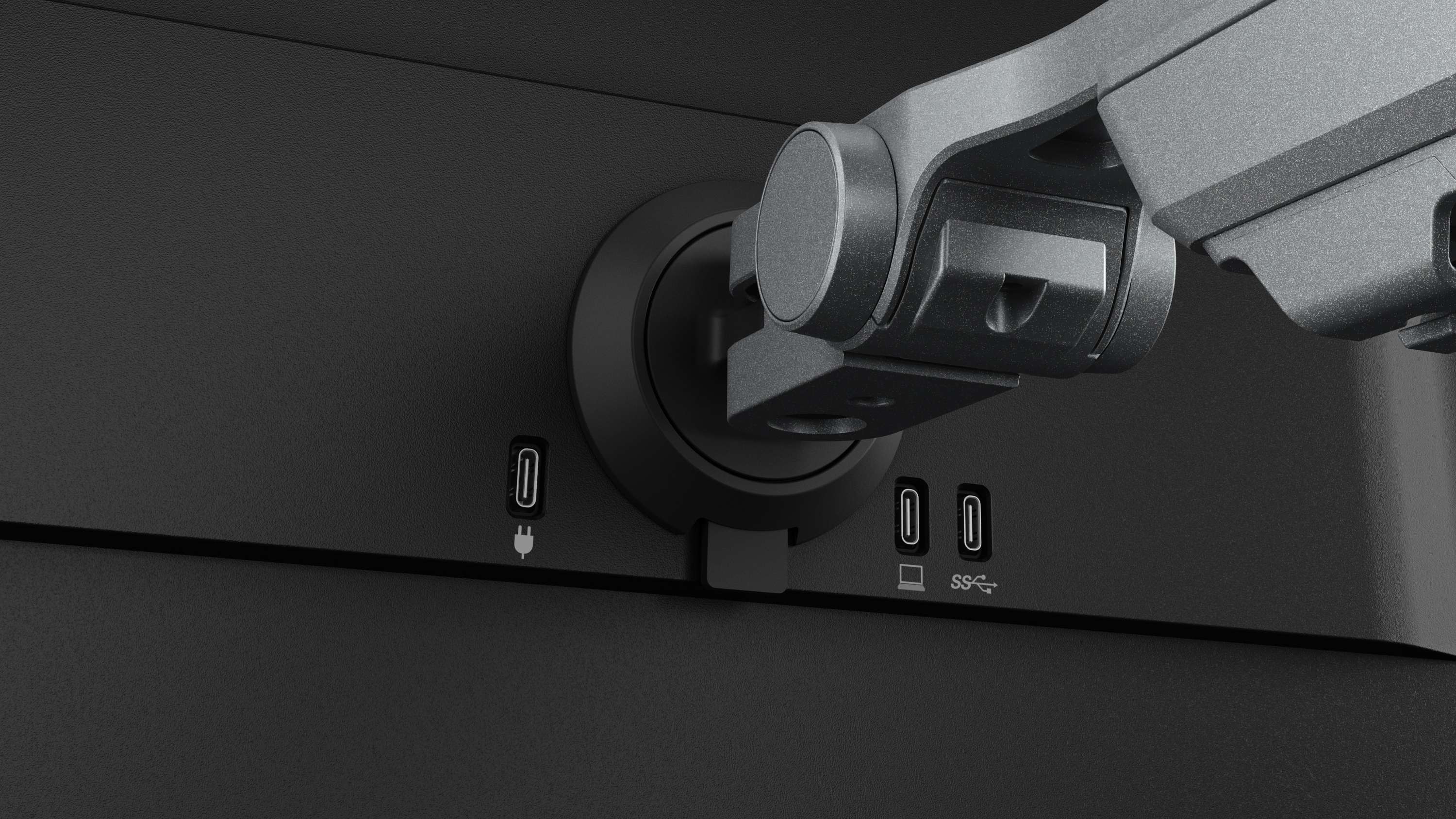 Nahaufnahme der Monitoranschlüsse. Zu den Anschlüssen gehören ein Stromanschluss, zwei USB-C-Anschlüsse und ein SS-Symbol.