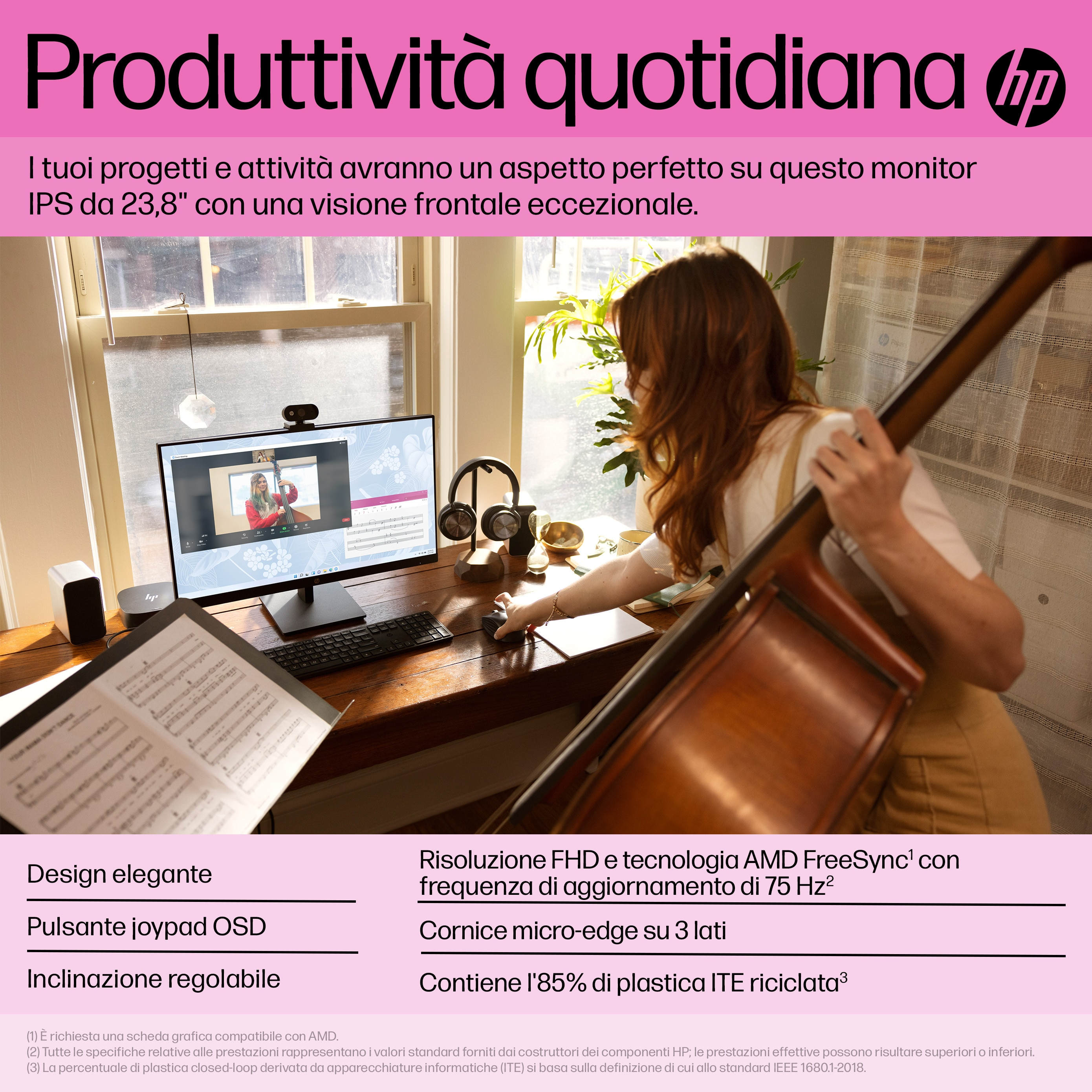 Kobieta przy biurku z monitorem, wiolonczelą i nutami. Tło: okno i pokój.