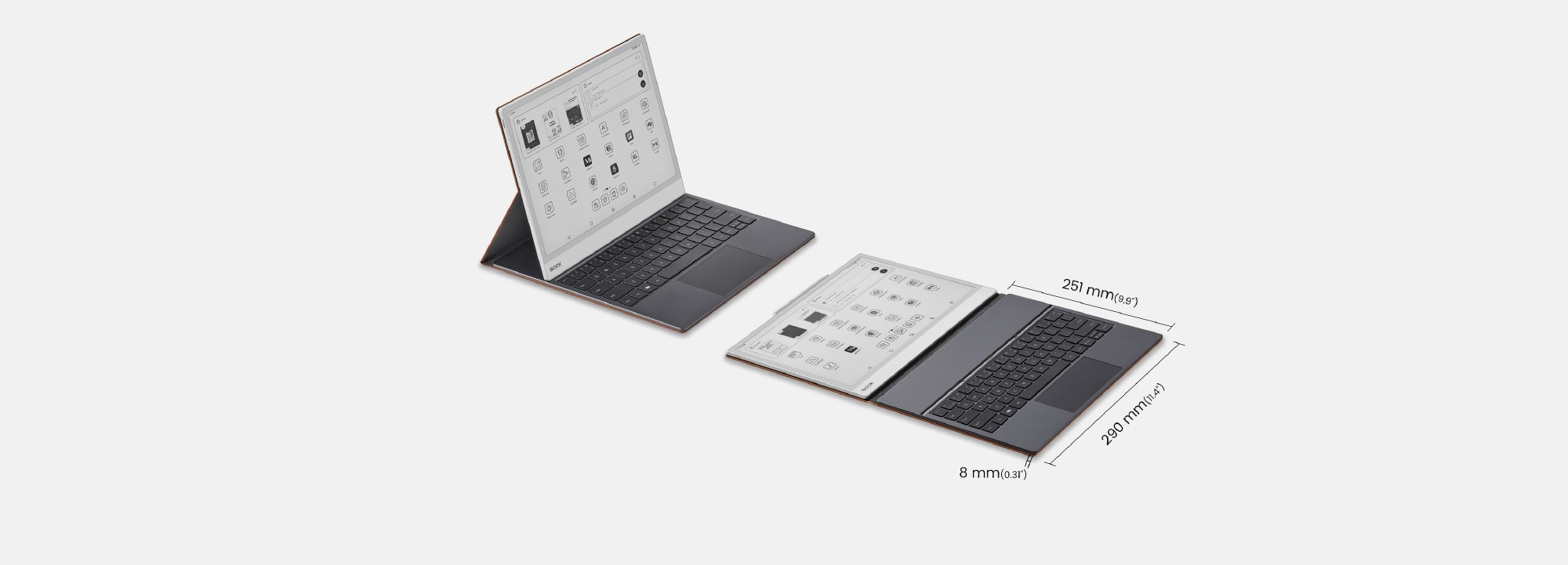 Due laptop con tastiera e schermo, uno aperto, uno chiuso, su una superficie chiara.