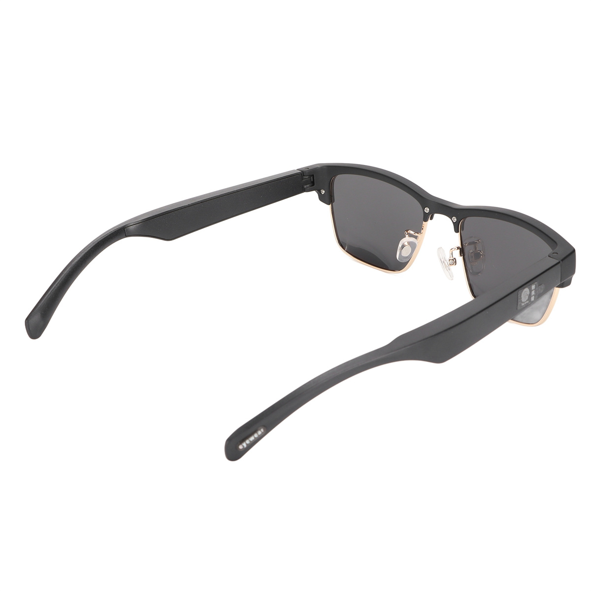 Schwarze Sonnenbrille mit goldenen Akzenten, von oben betrachtet, mit schwarzem Rahmen.