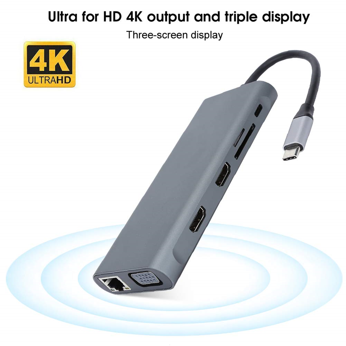 Grauer Hub mit mehreren Anschlüssen, verbunden mit einem silbernen USB-C-Kabel.