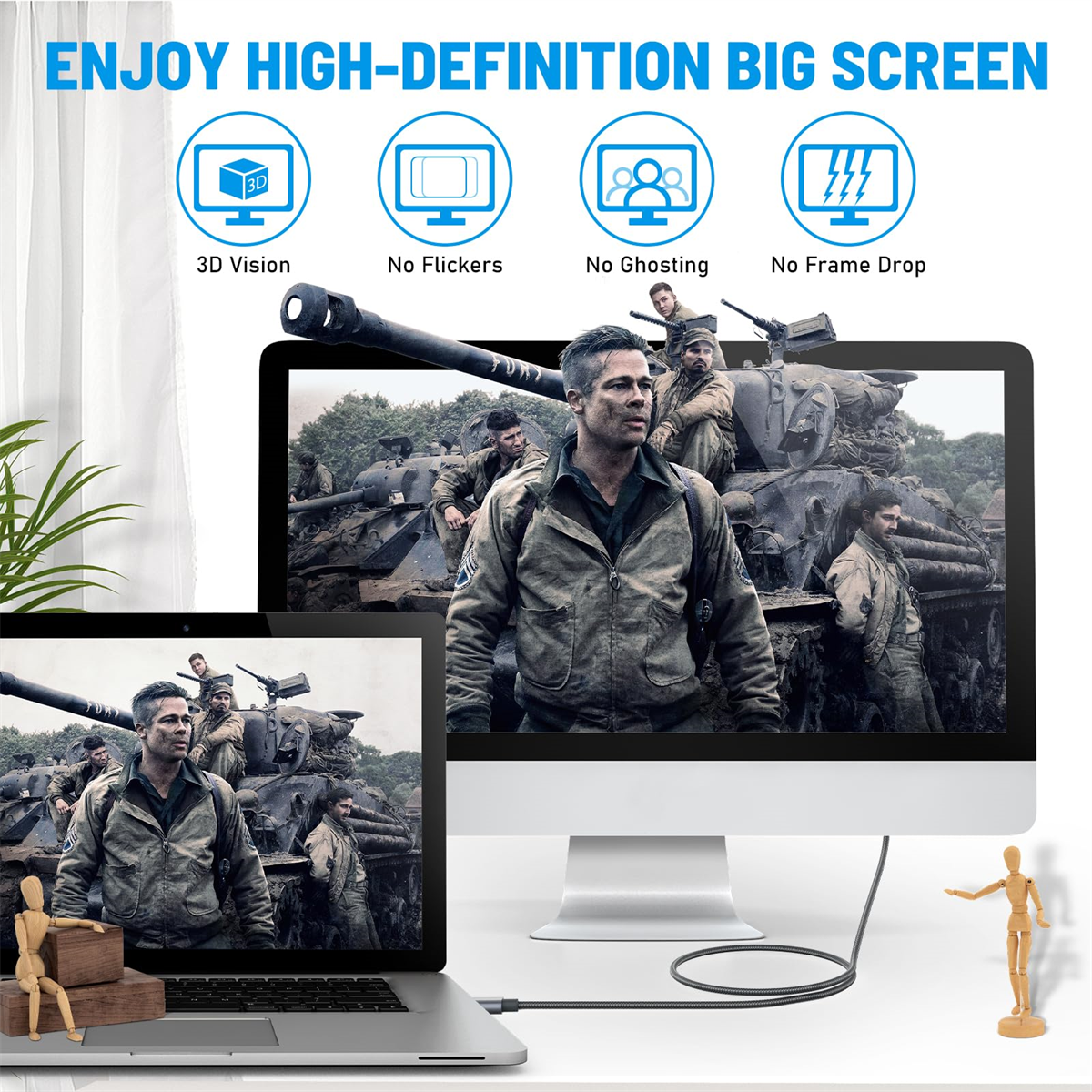 Bildschirme, die eine Filmszene zeigen, mit einem Laptop und einer Holzfigur.
