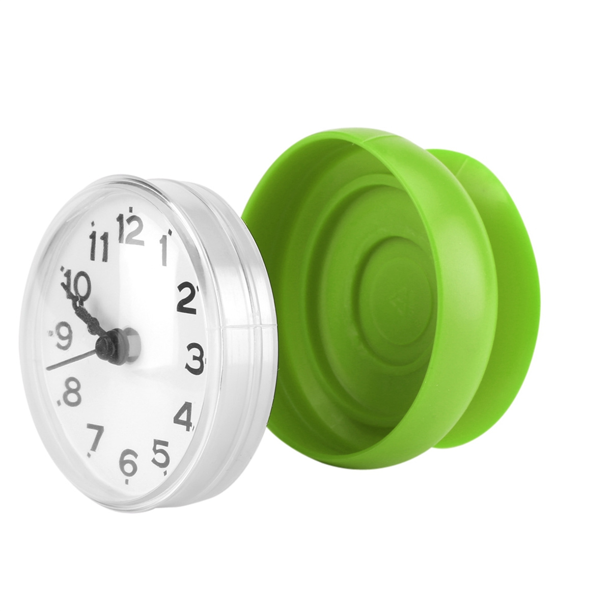 Eine kleine Uhr mit weißem Zifferblatt und grüner Umgebung.