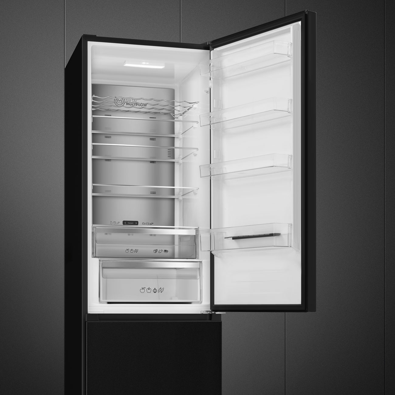 Otwarta lodówka z półkami, szufladami i widocznymi światłami.