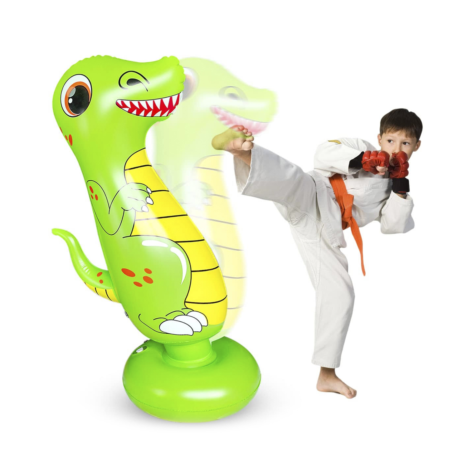 Un niño pateando un juguete inflable de dinosaurio verde.