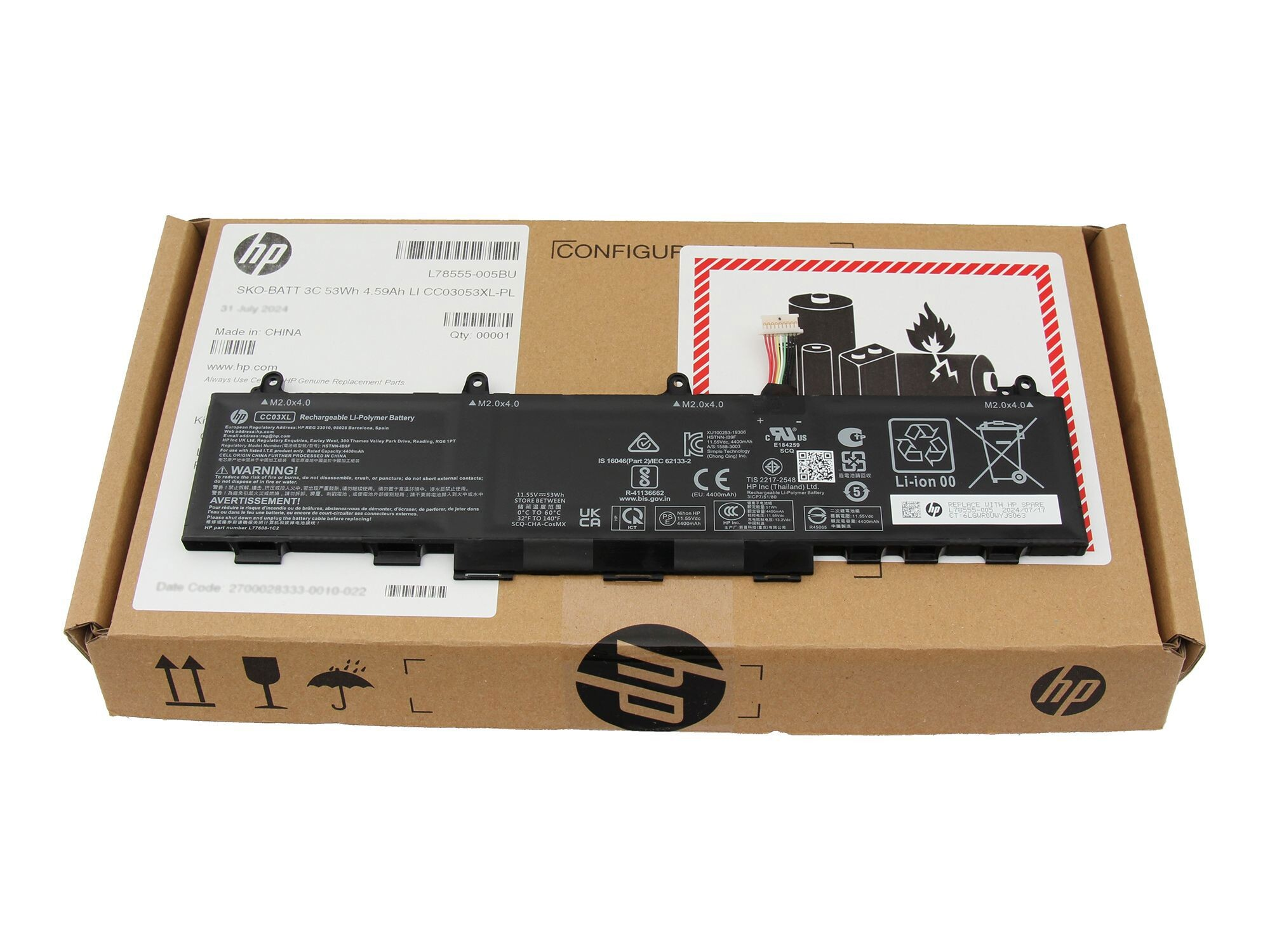 Ein Laptop-Akku in seiner Box, die Details des Akkus zeigend.